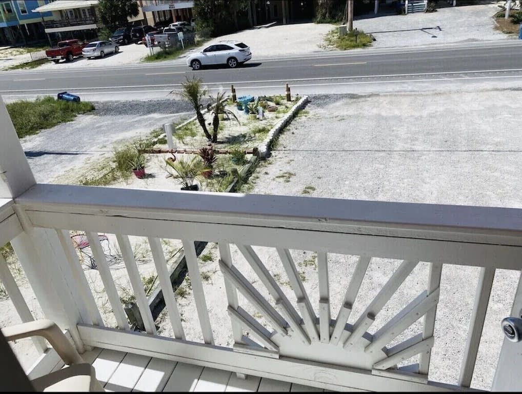 Private Balcony out of second master on main level. Faces the street.