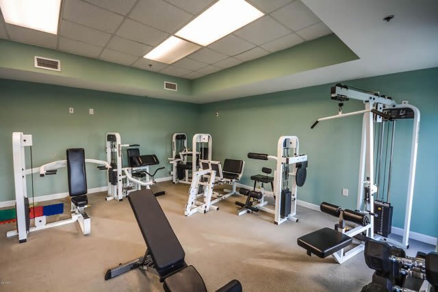 On-site fitness center with weight machines and strength training equipment