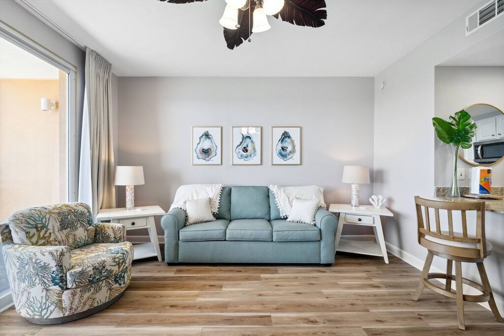 Living Room: Bright and airy space with stylish seating and beachy d&eacute;cor, perfect for relaxation!