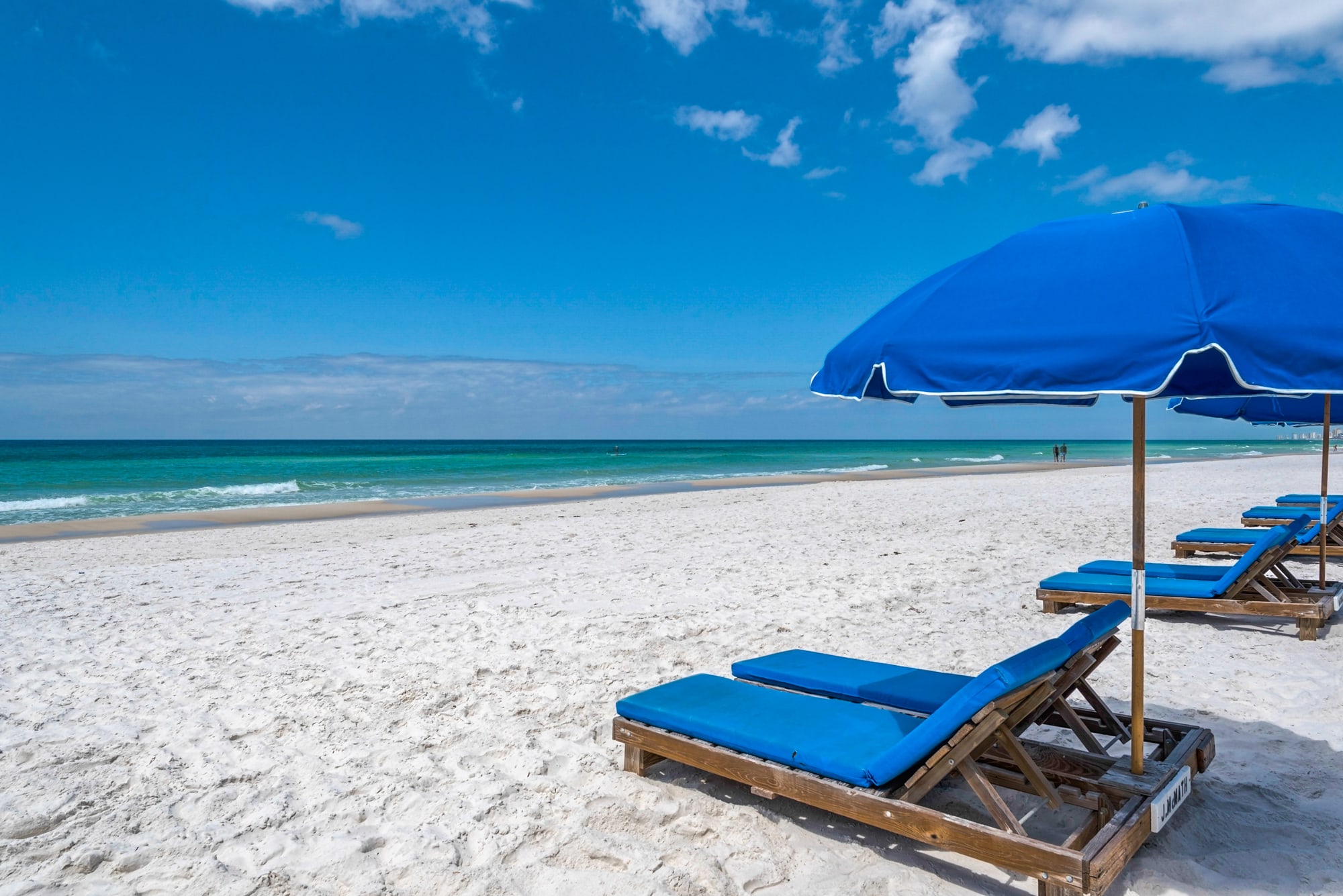 Set of  seasonal beach chairs with umbrella service is included with this condo