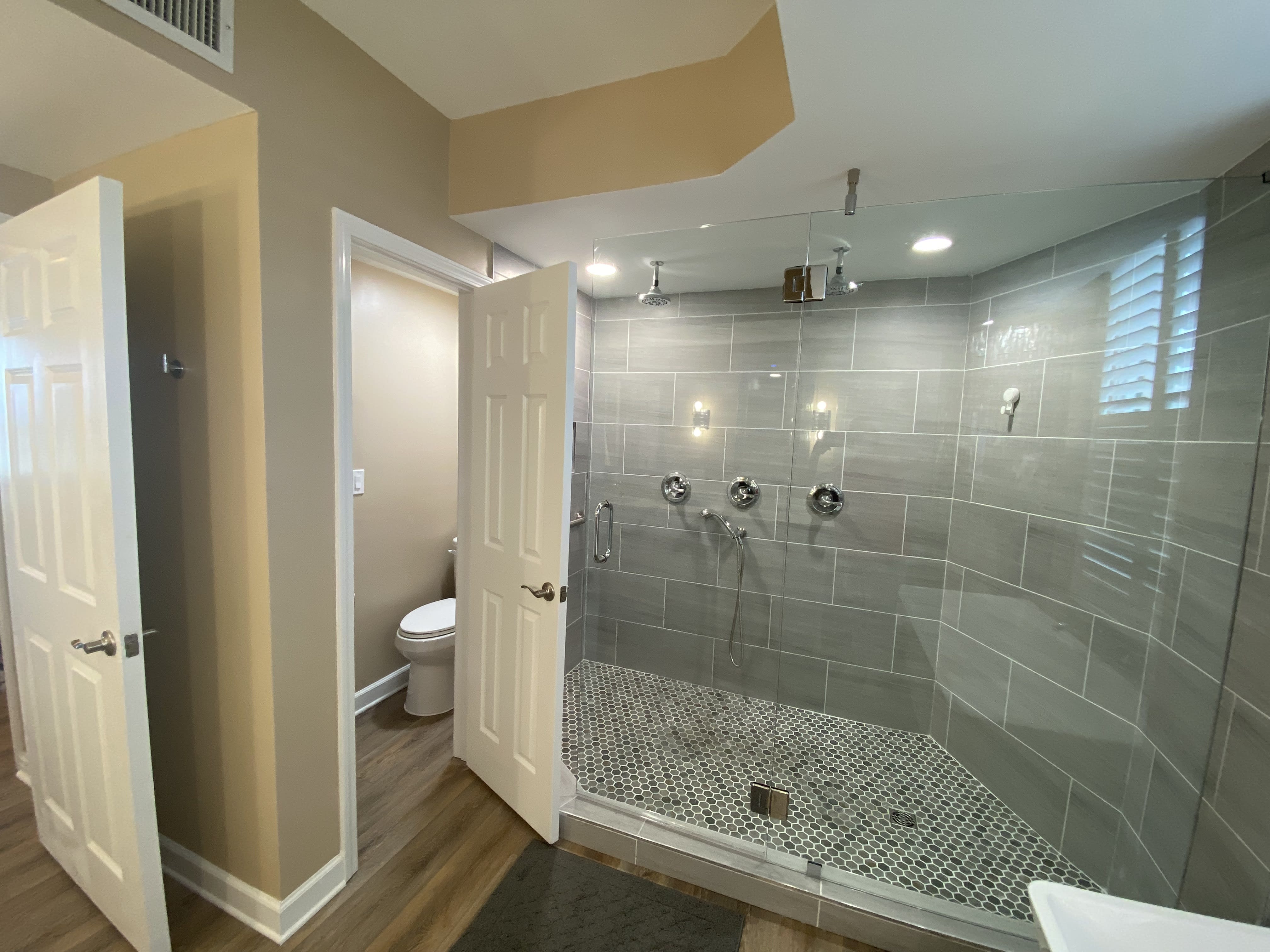 Oversized Shower with double rain heads - separate toilet area for privacy