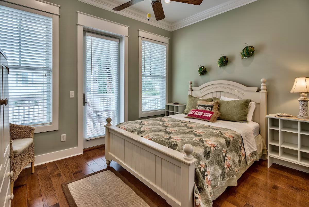 Downstairs bedroom with private bath/shower viewed from entry door.