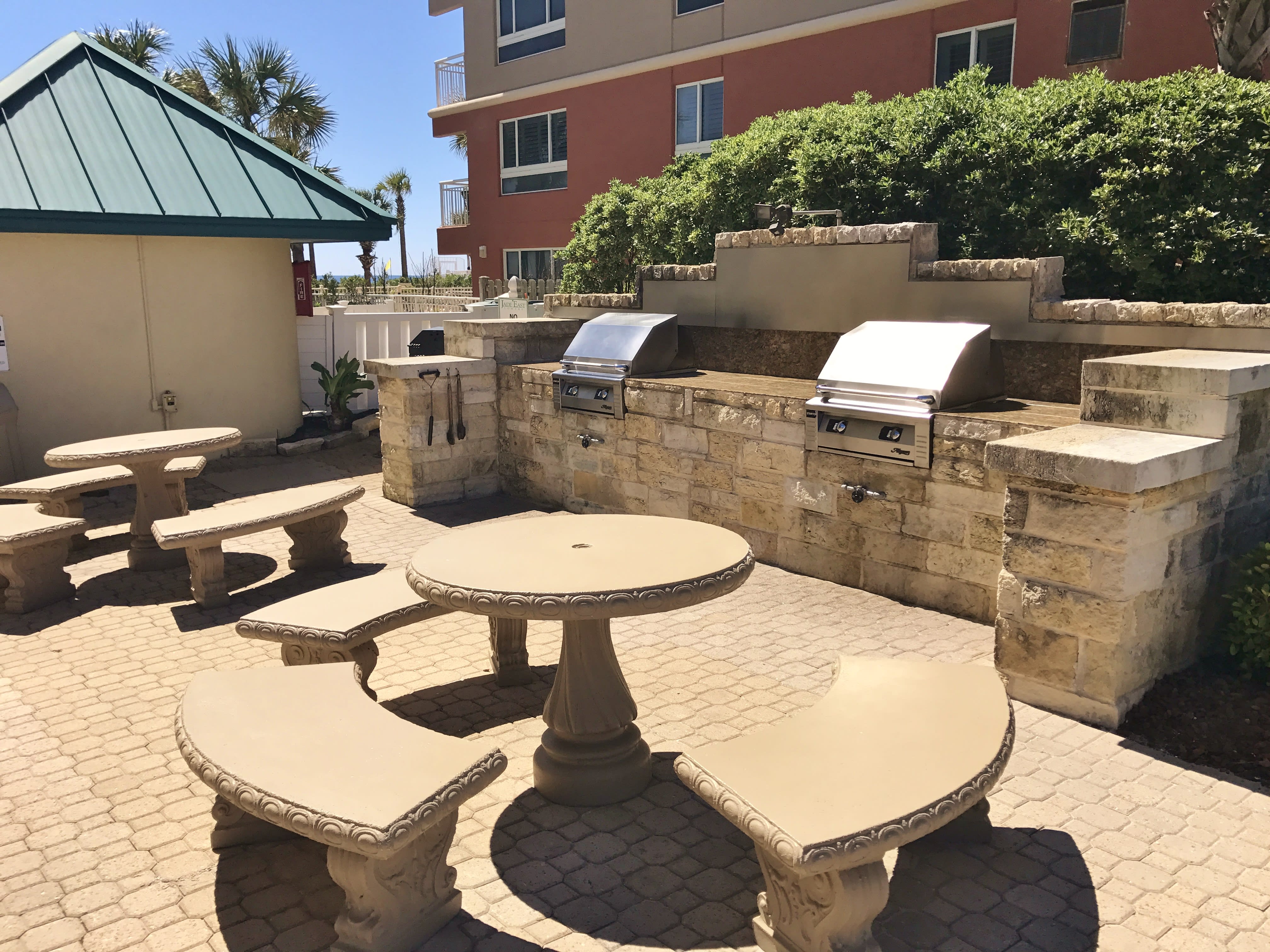 BBQ area has gas and charcoal grills with picnic tables