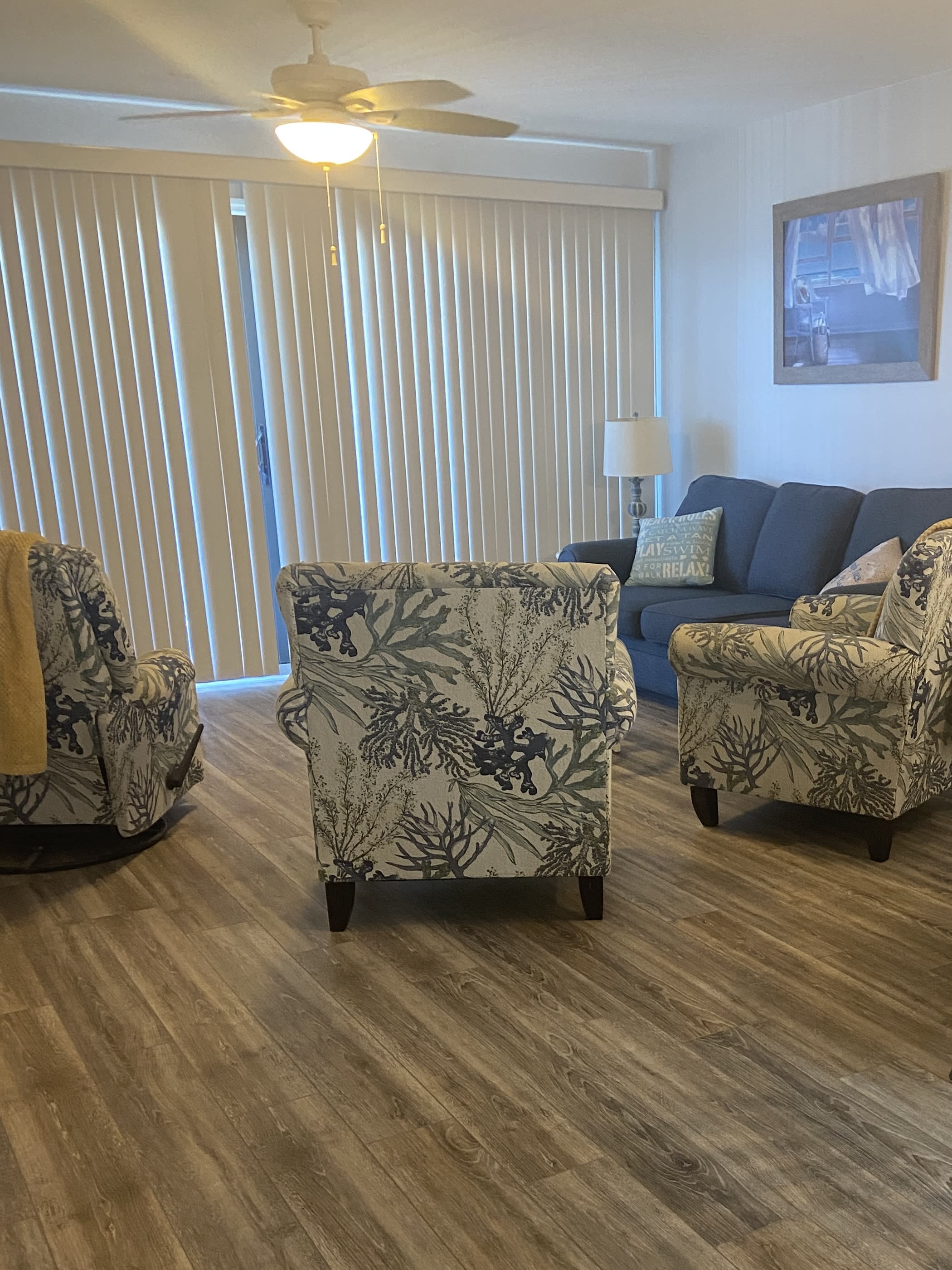 The living area offers ample seating including a recliner. 