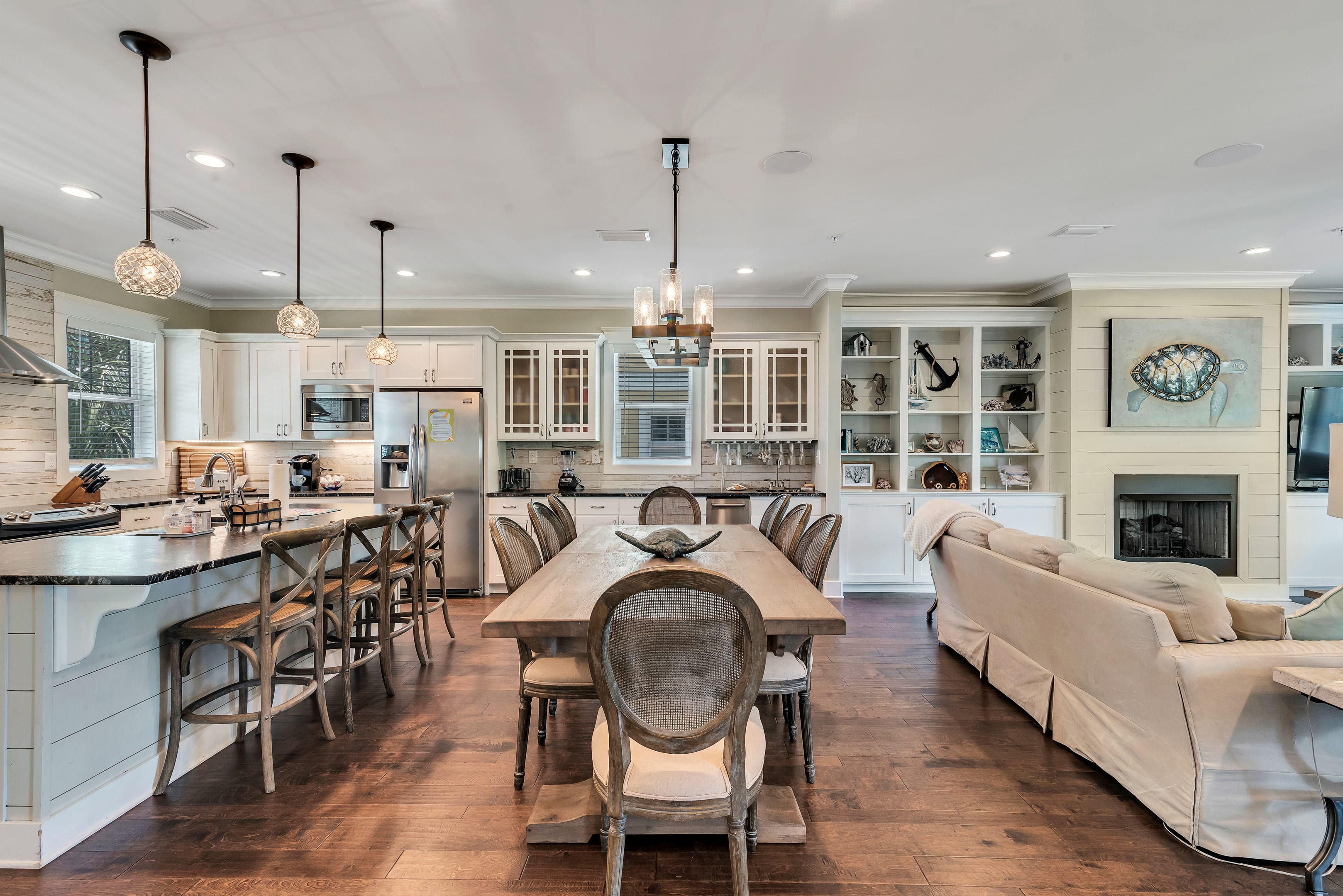 Dining area with seating for 14 at table and counter.