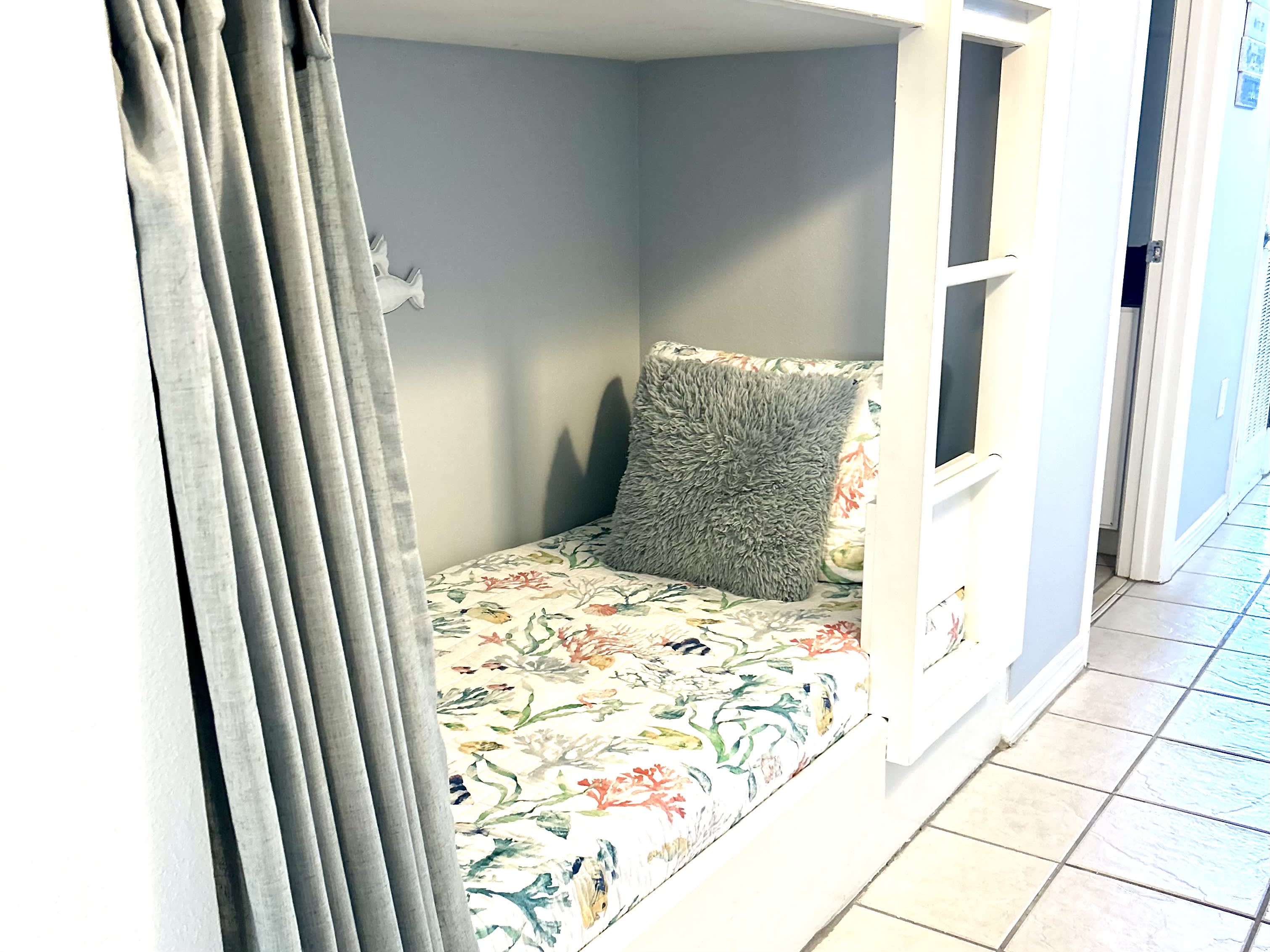 Twin size bunk beds in the hallway.