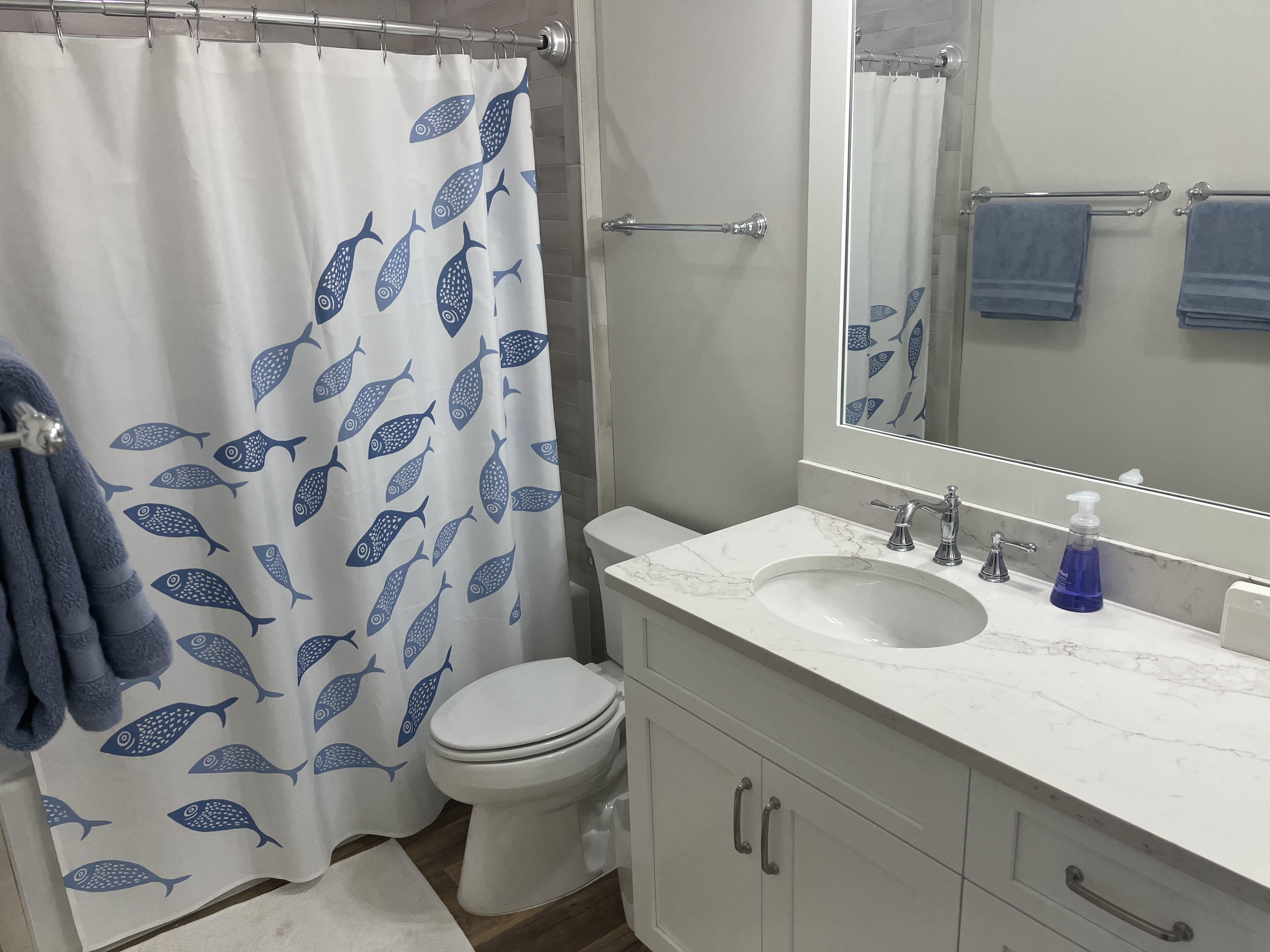 Boys' bath has tub/shower, two lavatories, &amp; plenty of towel rods.