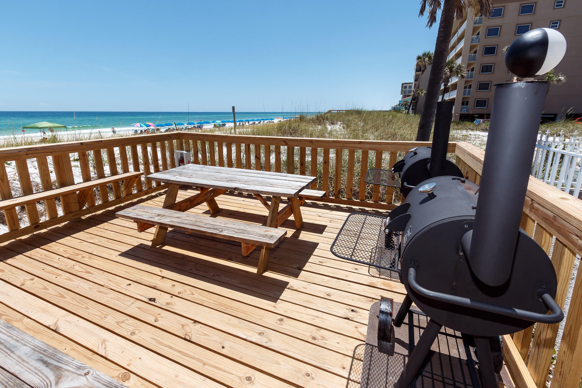 There are three charcoal grills and plenty of seating for outdoor dining. 