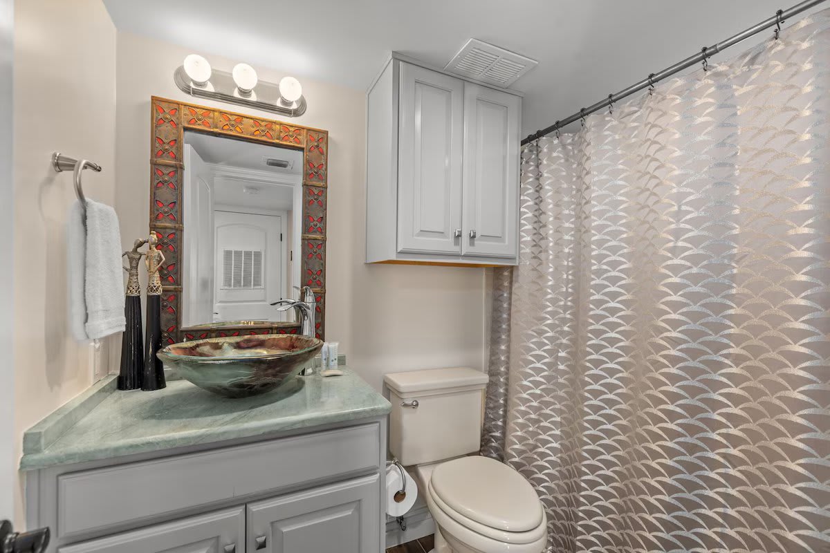 Custom decorative glass sinks in each bathroom. Zoom in to this one. L&rsquo;Occitane!