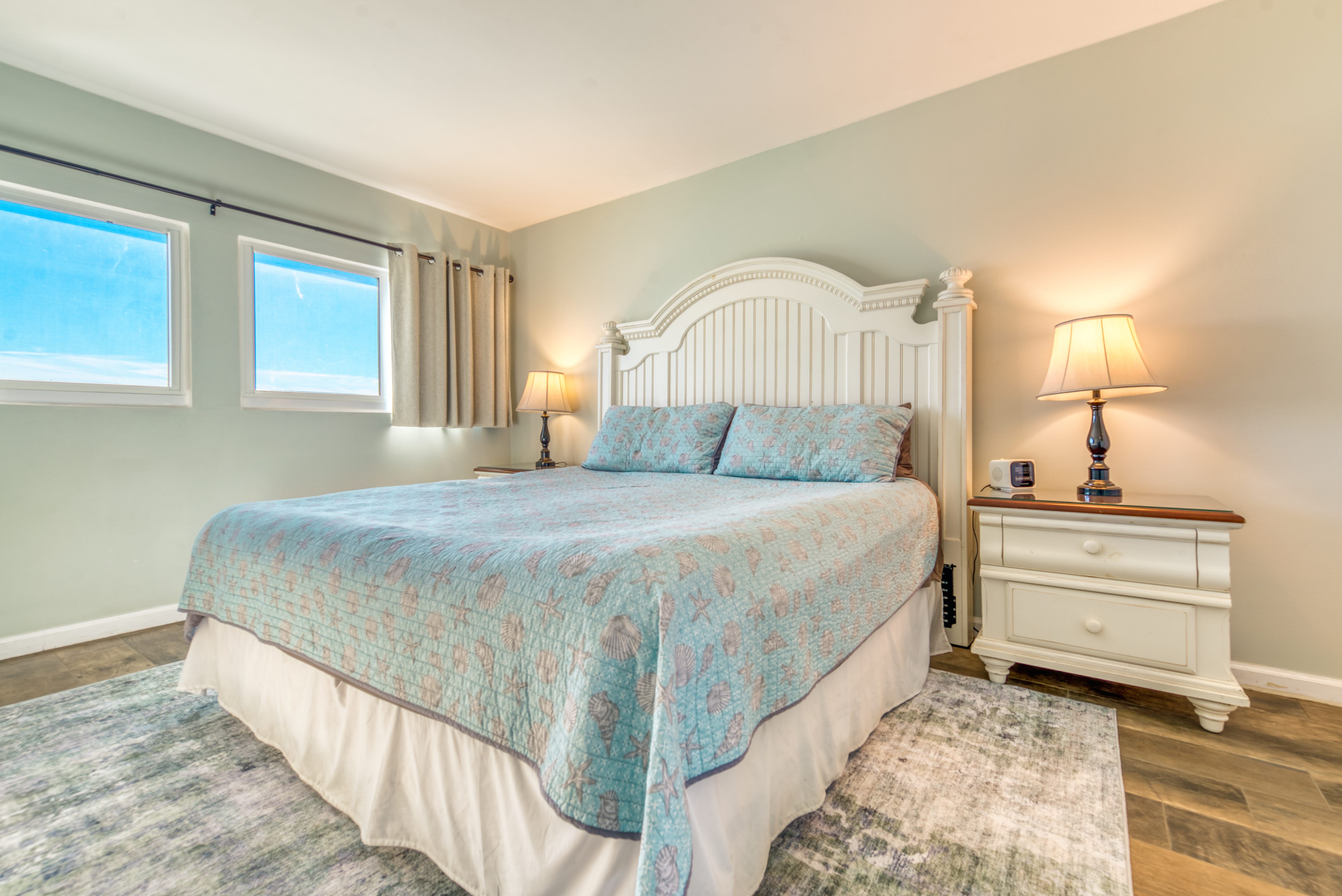 Sleep soundly in a comfy king bed with a serene beach vibe.