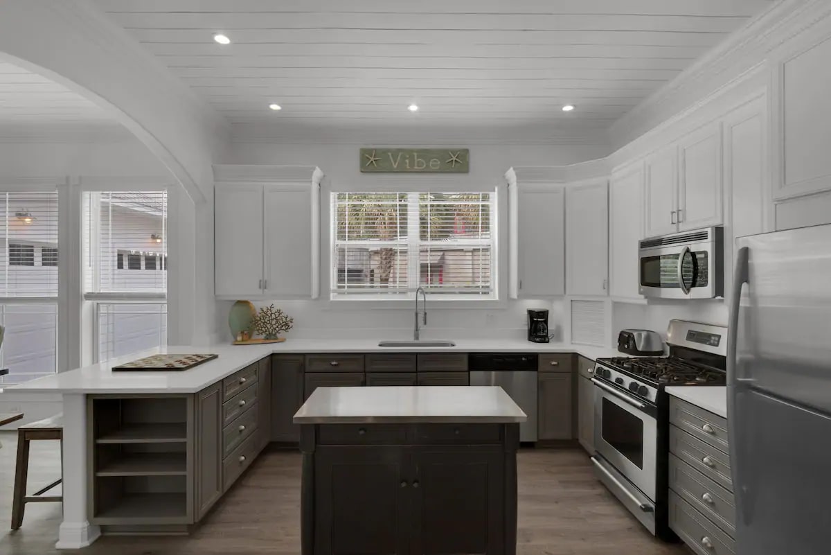 Vibe-11 Brand new quartz counters with gas range and fully equipped kitchen stand ready for your culinary masterpiece.