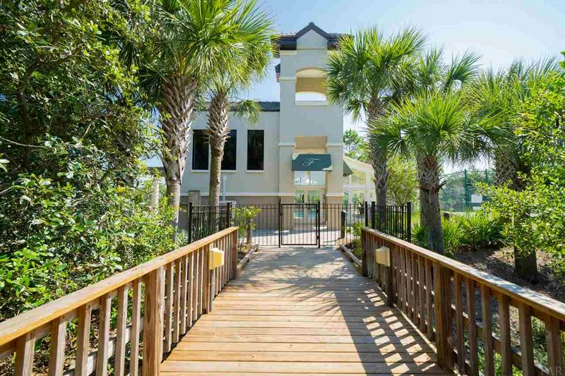 Lush landscaping surrounds indoor pool retractable roof.Adjacent to tennis court