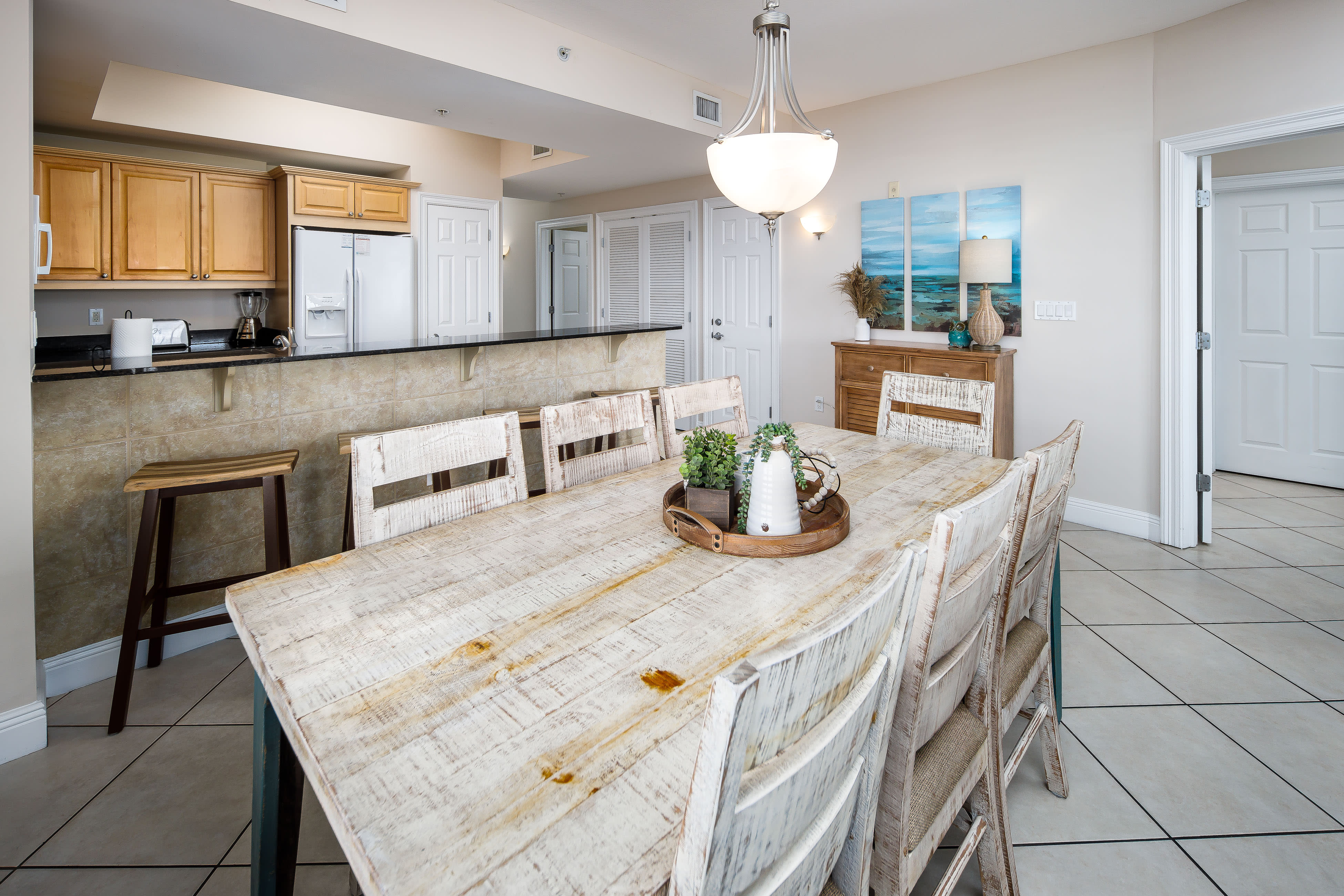 We have a large dining table for 8 with 4 seats at the bar!