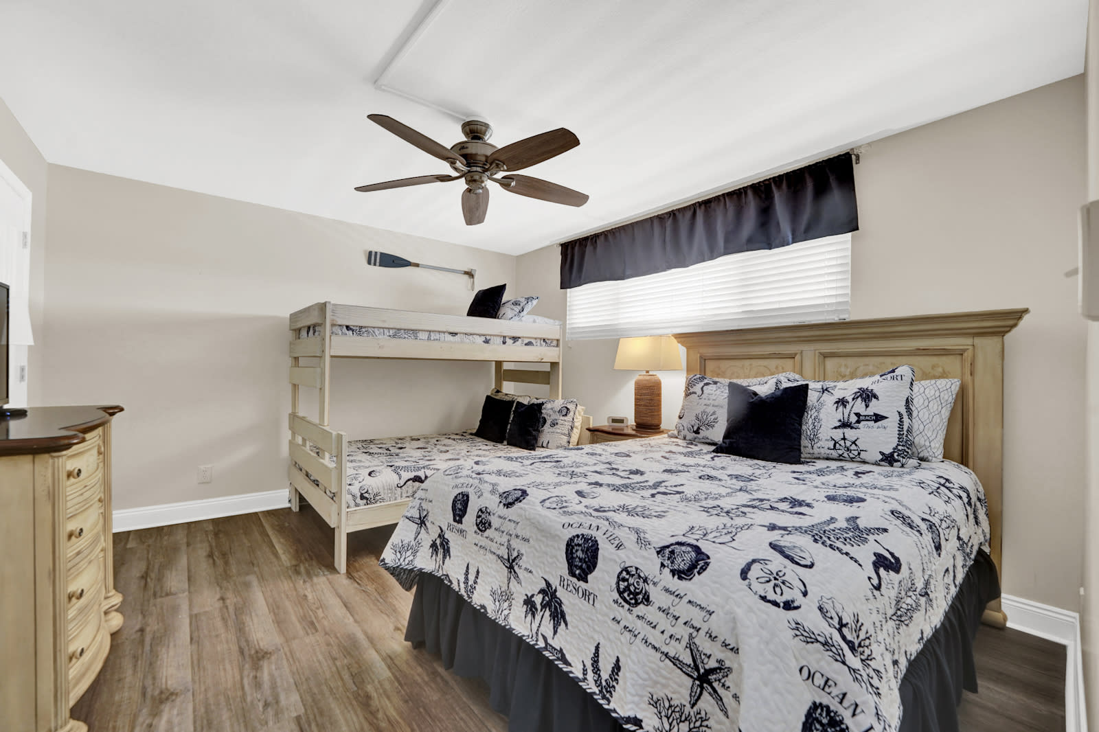 Guest room which includes a queen and twin over full bunk bed.