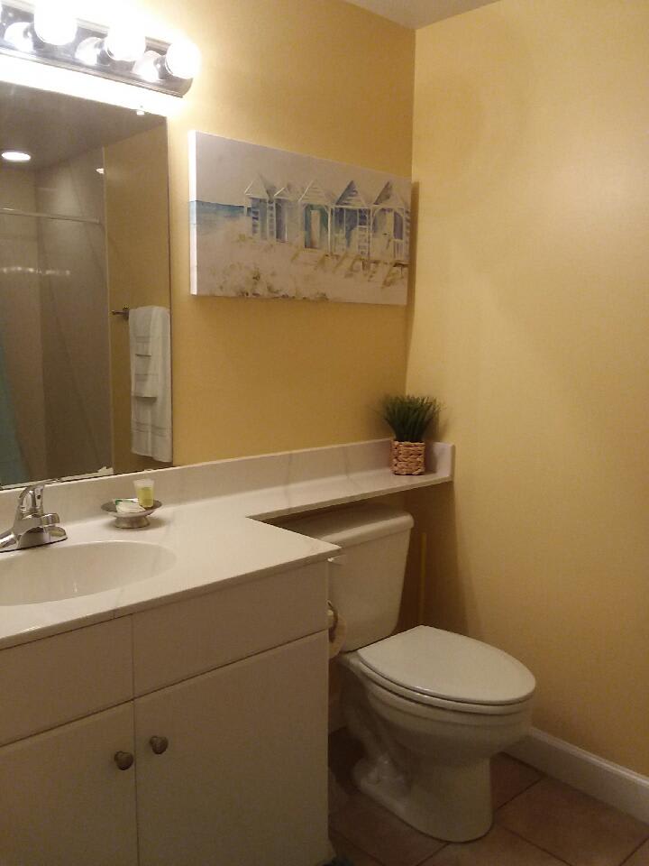 Bunk bathroom with walk in shower.