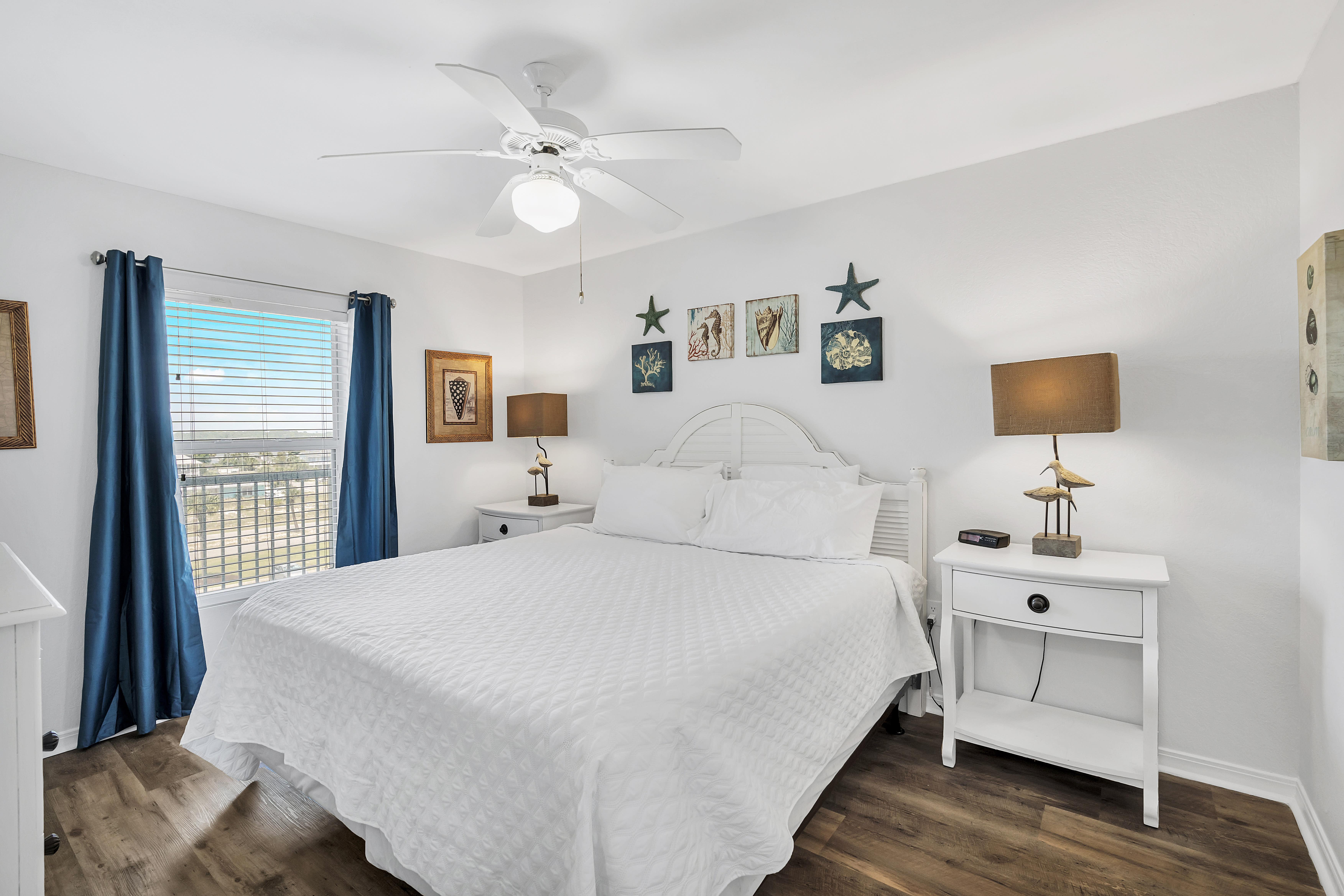 Master Bedroom with King Bed and twin bedside tables and TV.
