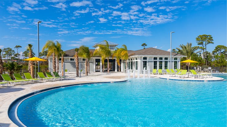 Resort pool with hot tub, bathrooms, and fitness room