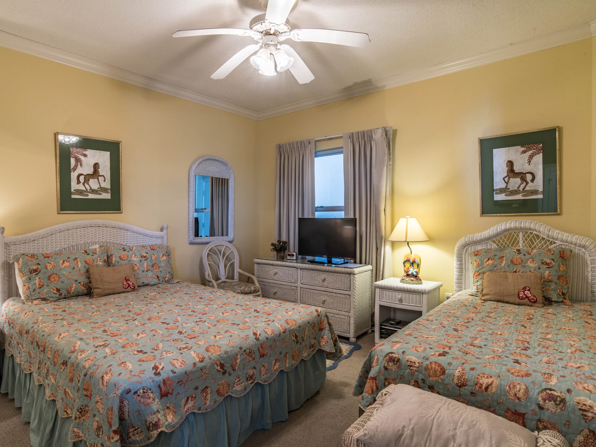 Middle Bedroom with one Queen and one Single bed.