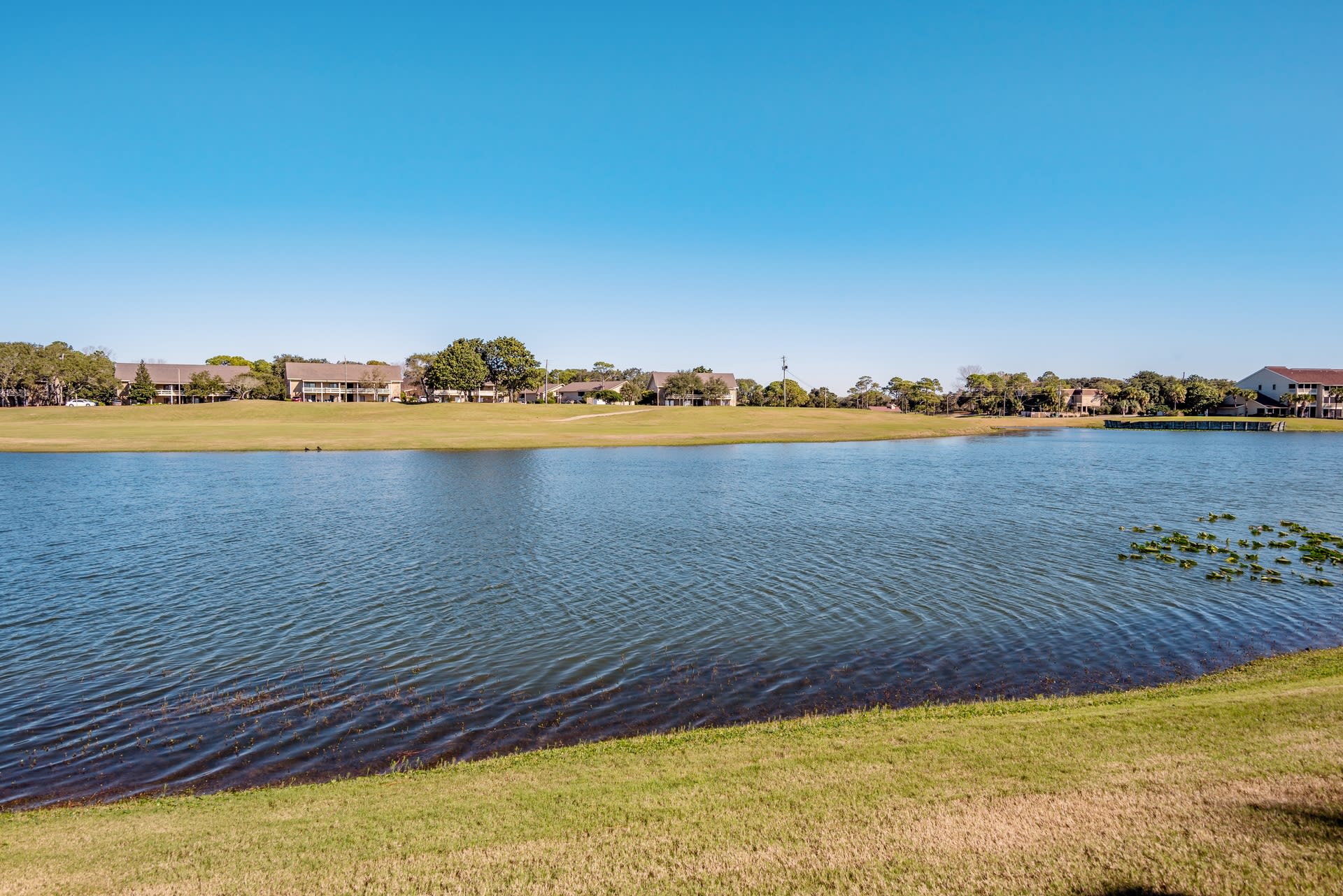 View from patio. 14th hole of golf course plays on the other side of the lake.
