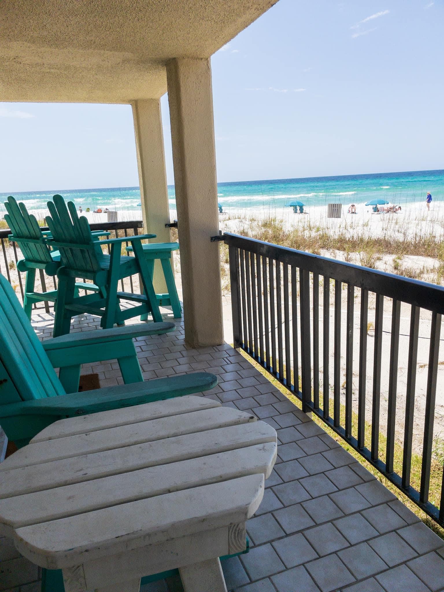 Wrap around balcony with furniture, sand toys, deck box storage for beach chairs and umbrellas 