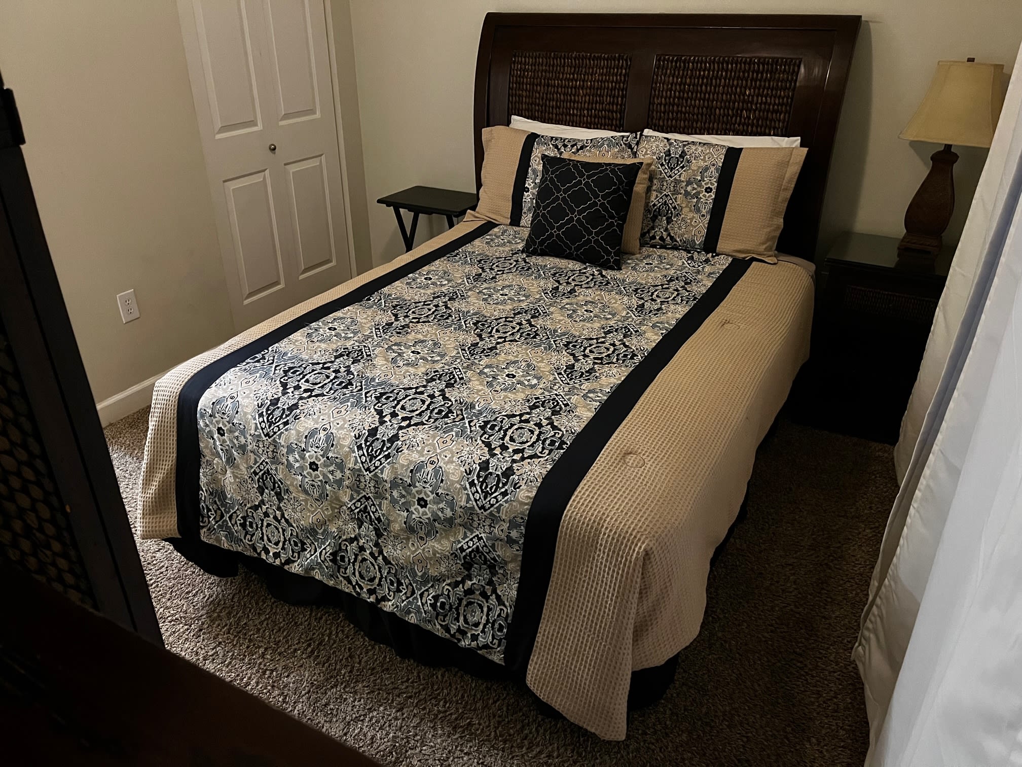 Guest room with queen bed. High boy w tv and dresser. Private bathroom.