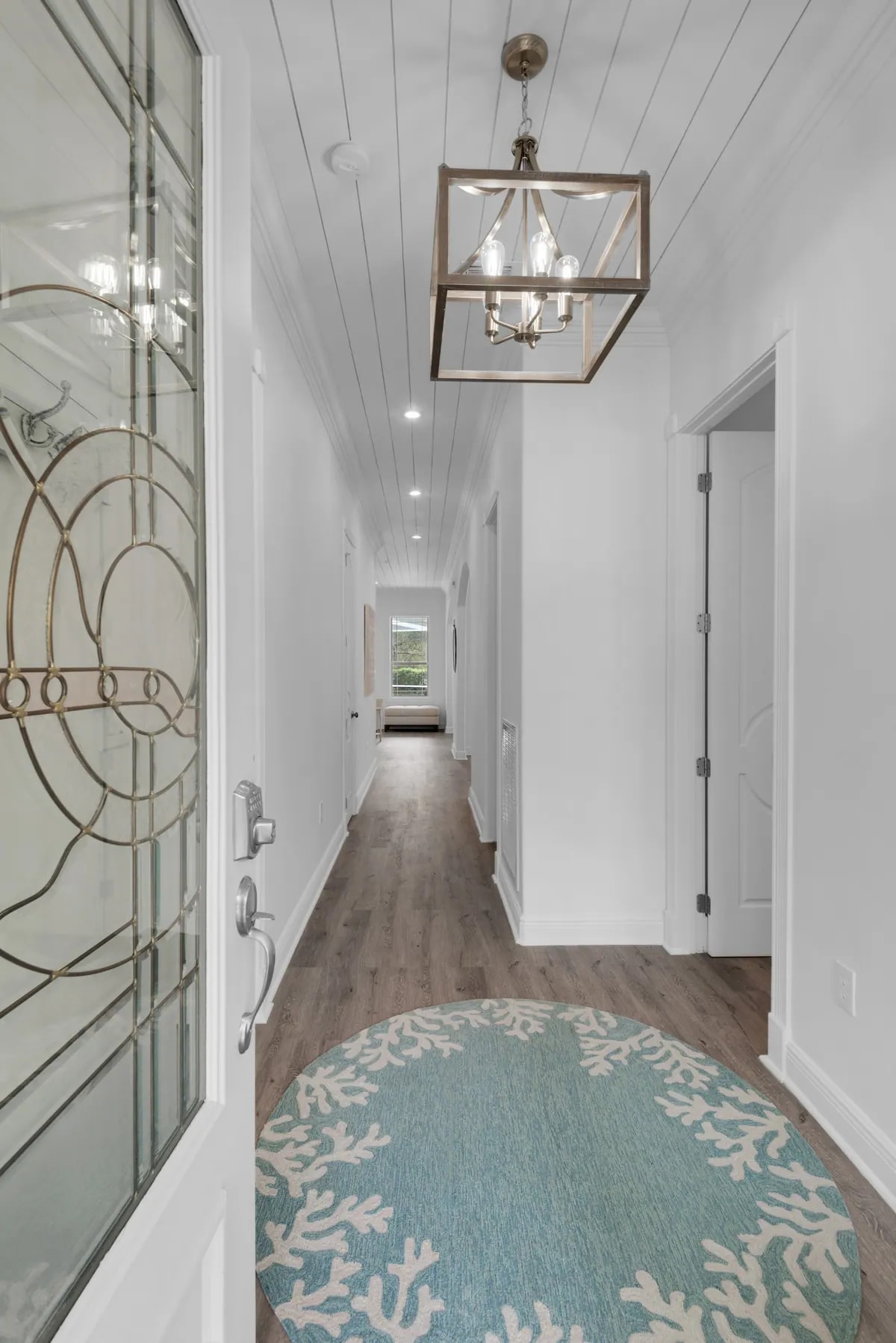 Vibe-3 Welcome to Vibe. Hand cut shiplap ceilings and driftwood colored floors create a vintage beach cottage feel.