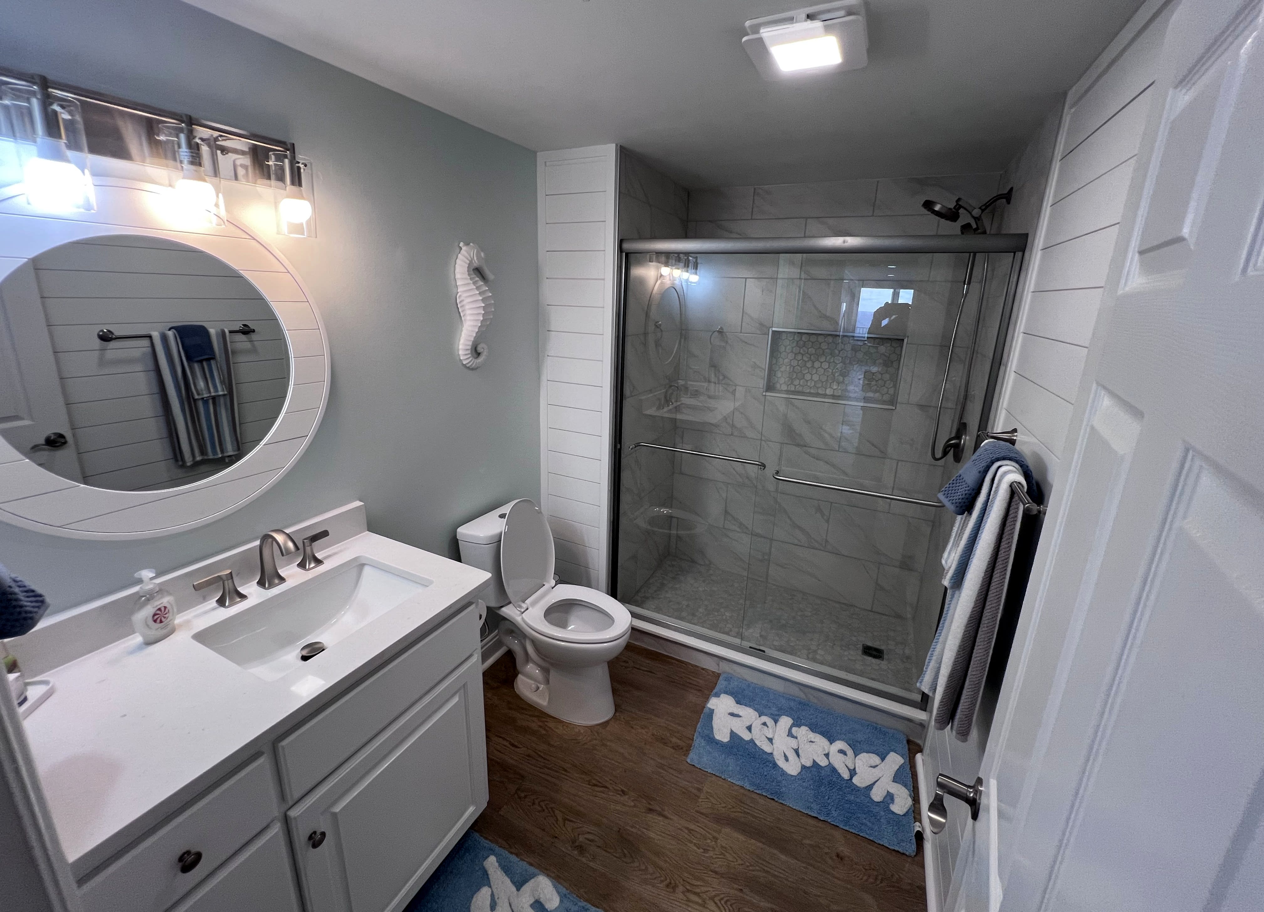 Guest bath with walk-in shower and quartz countertops