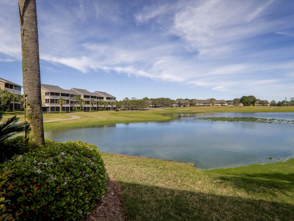 Patio view of lake and 14th green of Seascape golf course