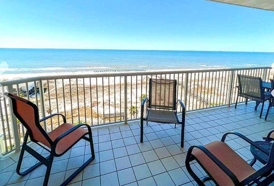 Large balcony overlooking the beautiful gulf and pools.
