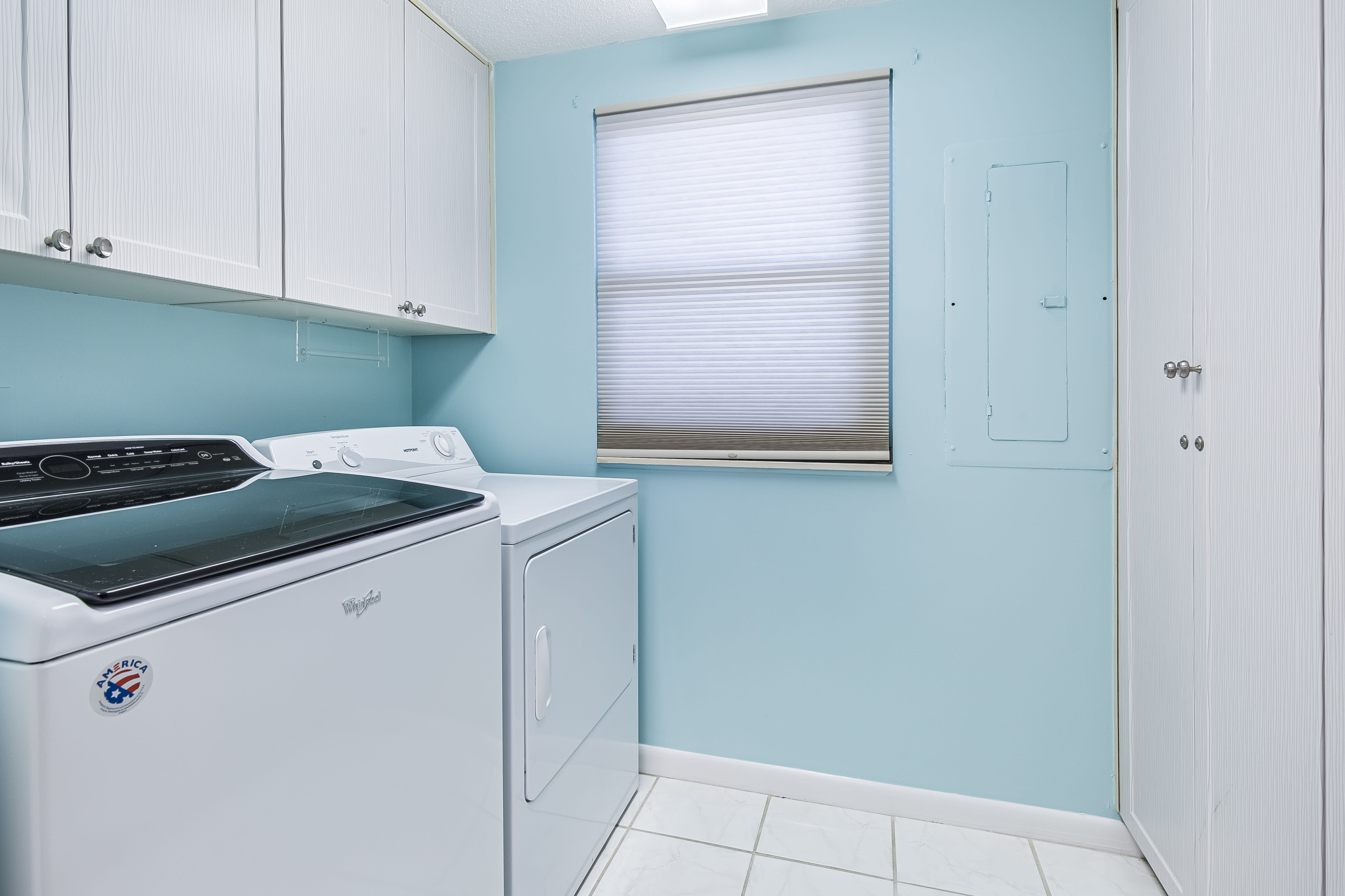 Laundry room with full size washer and dryer