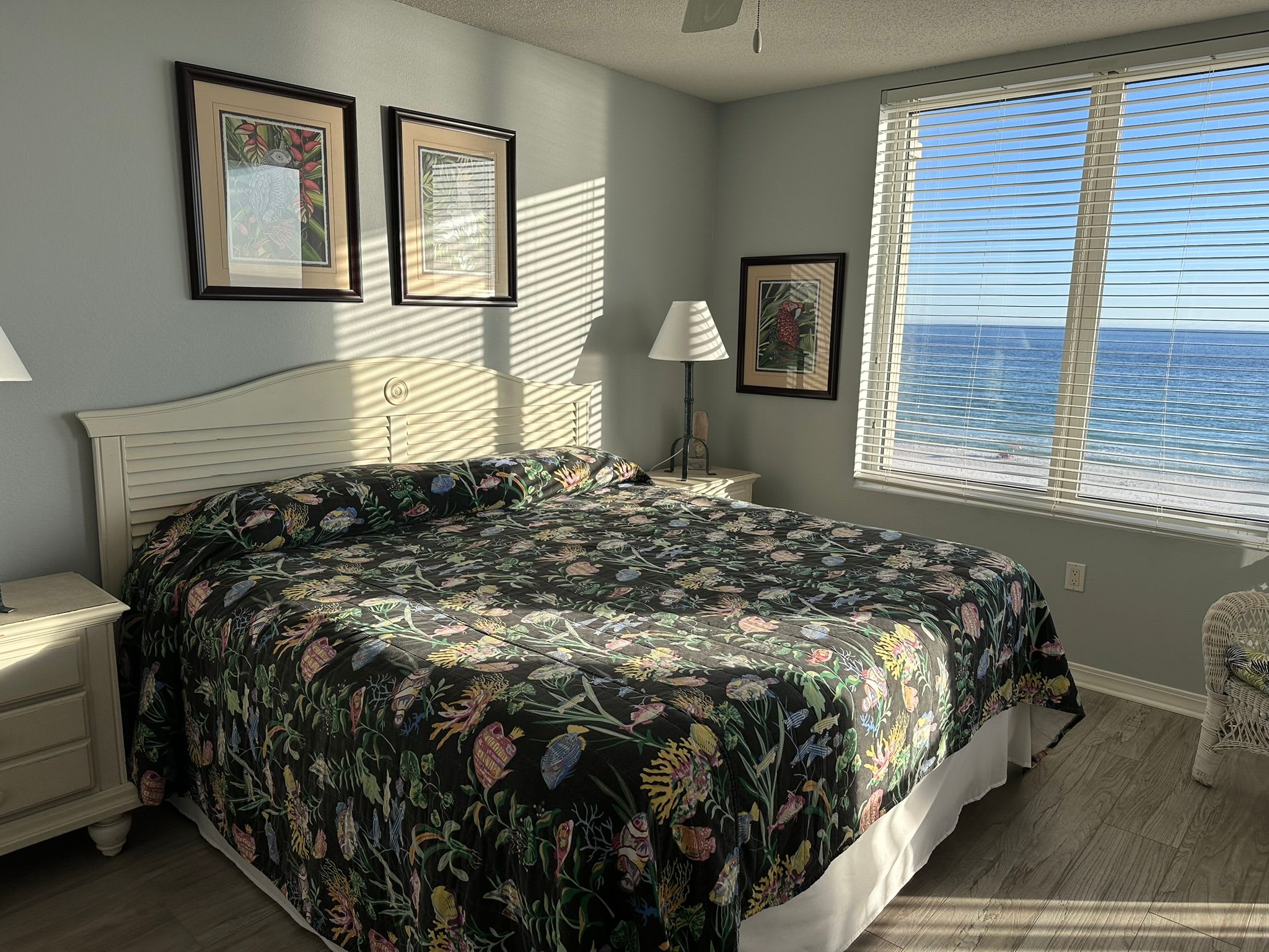 Master bedroom with updated flooring and bathroom with large walk-in shower.