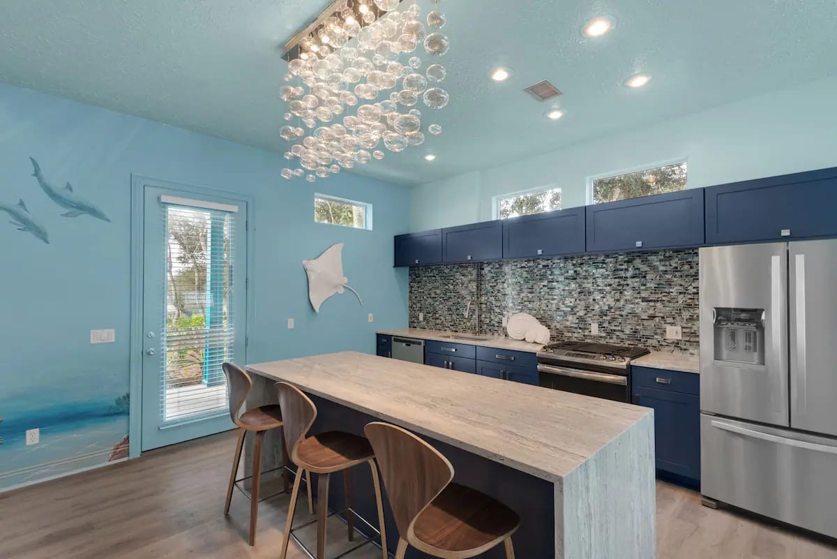 Aqua-9 Eat in the kitchen with a waterfall, granite island, and new stainless appliances.