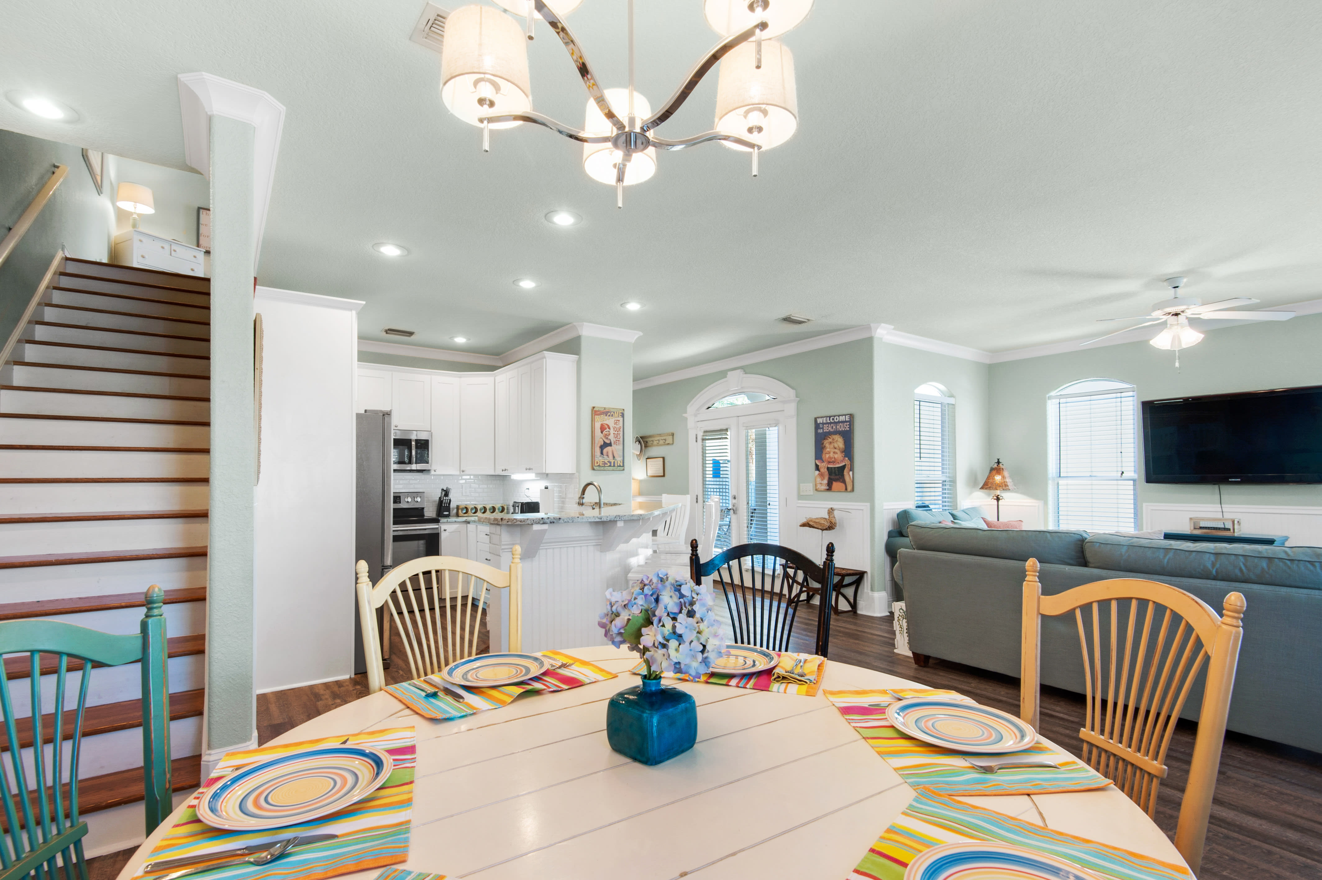View of the dinning area, kitchen and stairs to the second level
