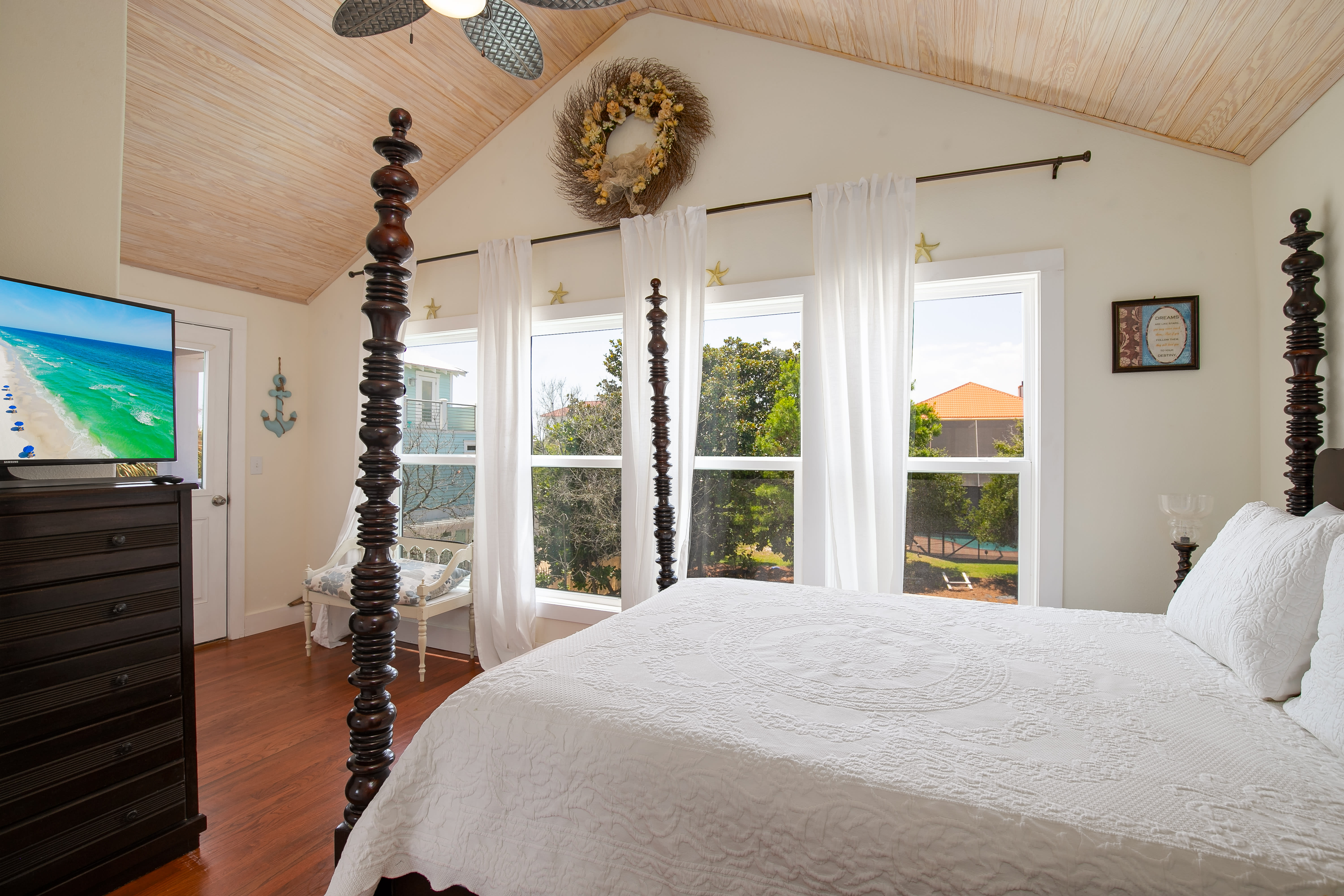 Upstairs BR with queen bed, tv, balcony and ensuite bath.