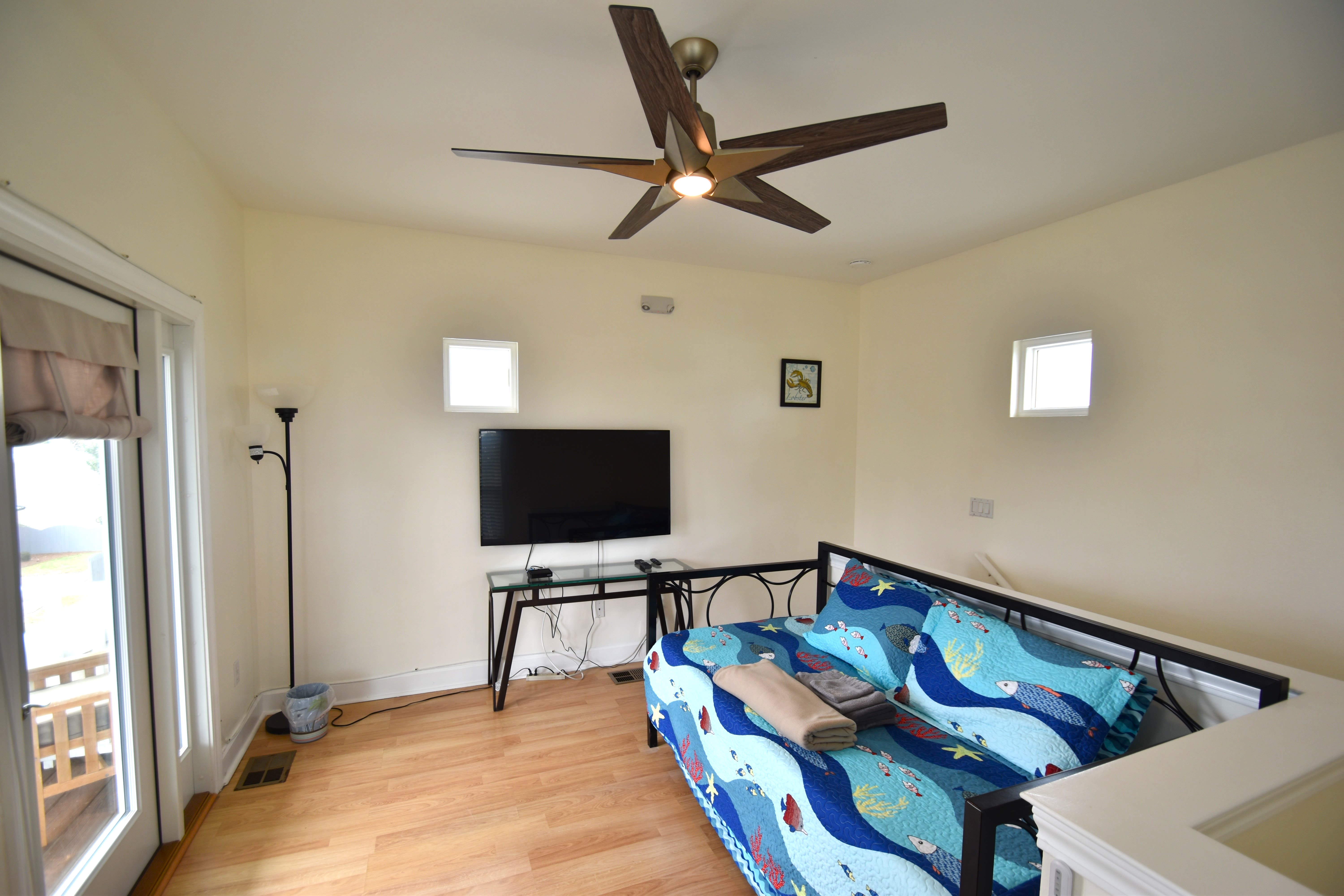 Loft bedroom with twin daybed popup trundle, 52 inch Roku TV, &amp; private balcony