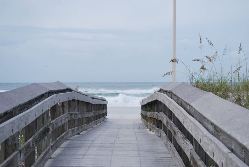 Boardwalk to sugar white, powder soft sand of Seagrove Beach and emerald water