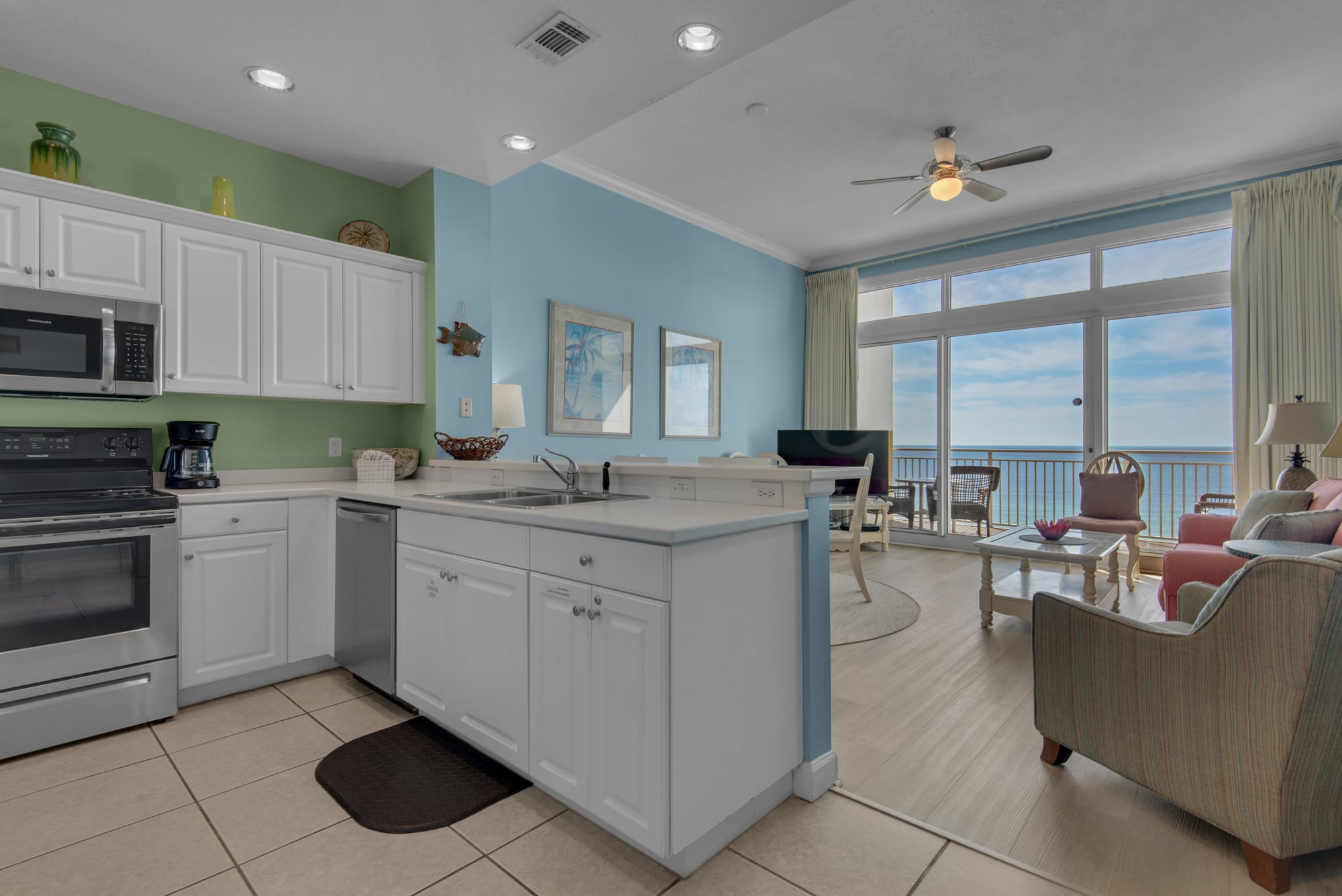 Kitchen and living room with wall to wall, floor to ceiling view!