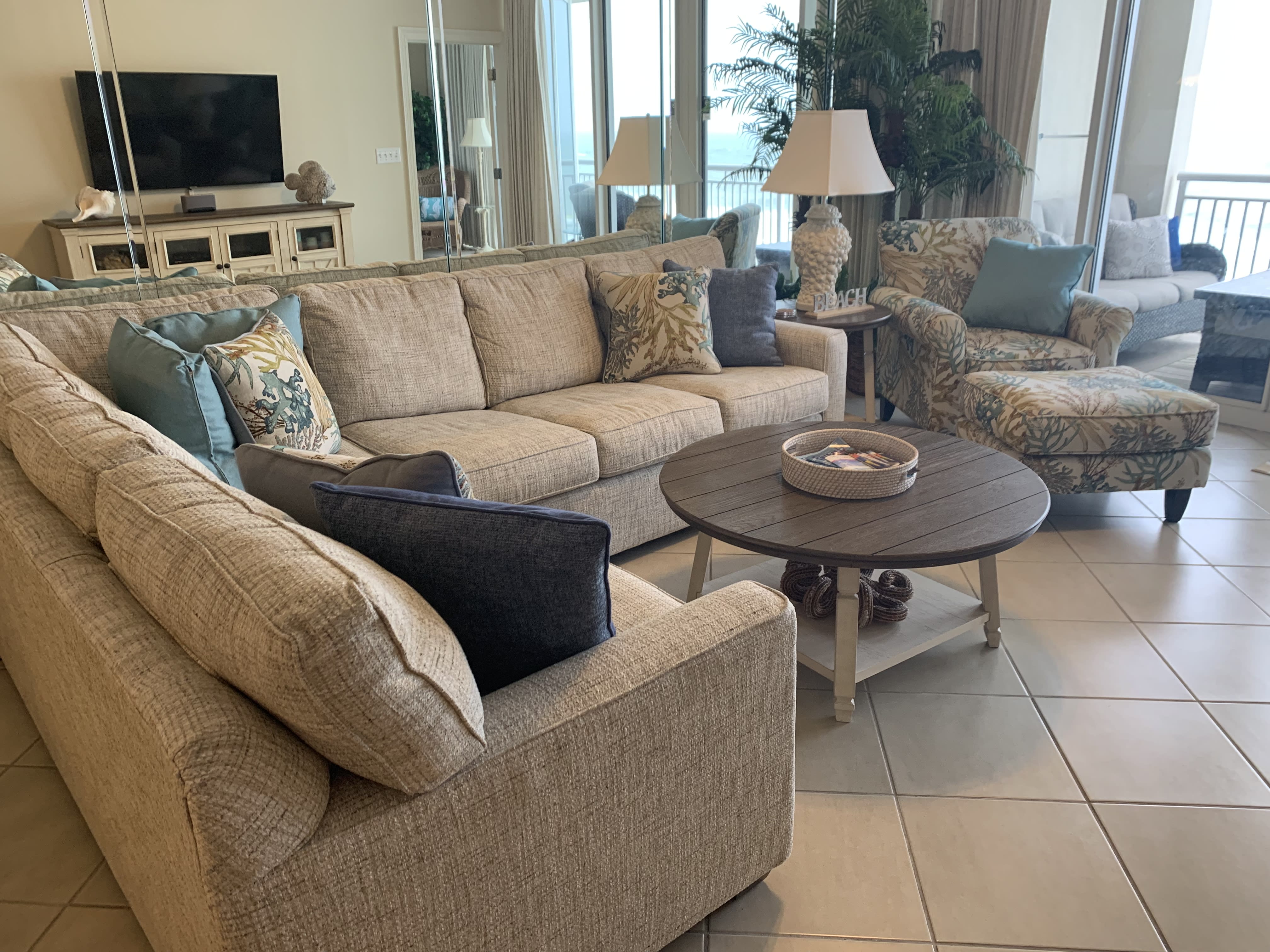 Beautiful living area with a sleeper queen sofa and a 55 inch smart tv.