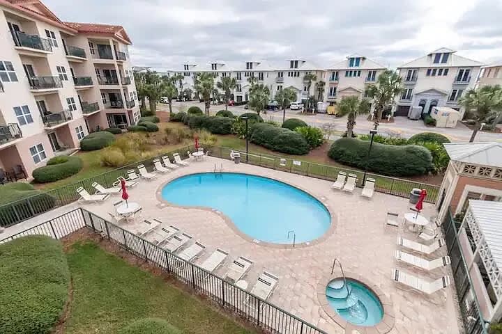 Building exterior, pool, and hot tub