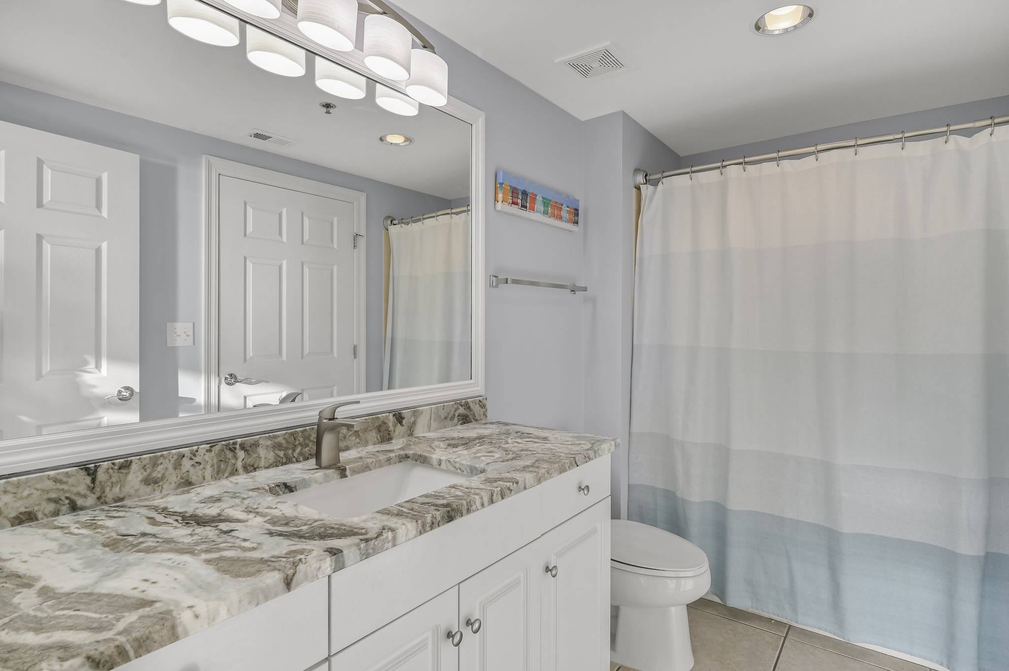 3rd bathroom with shower and tub combo.  New Granite and light