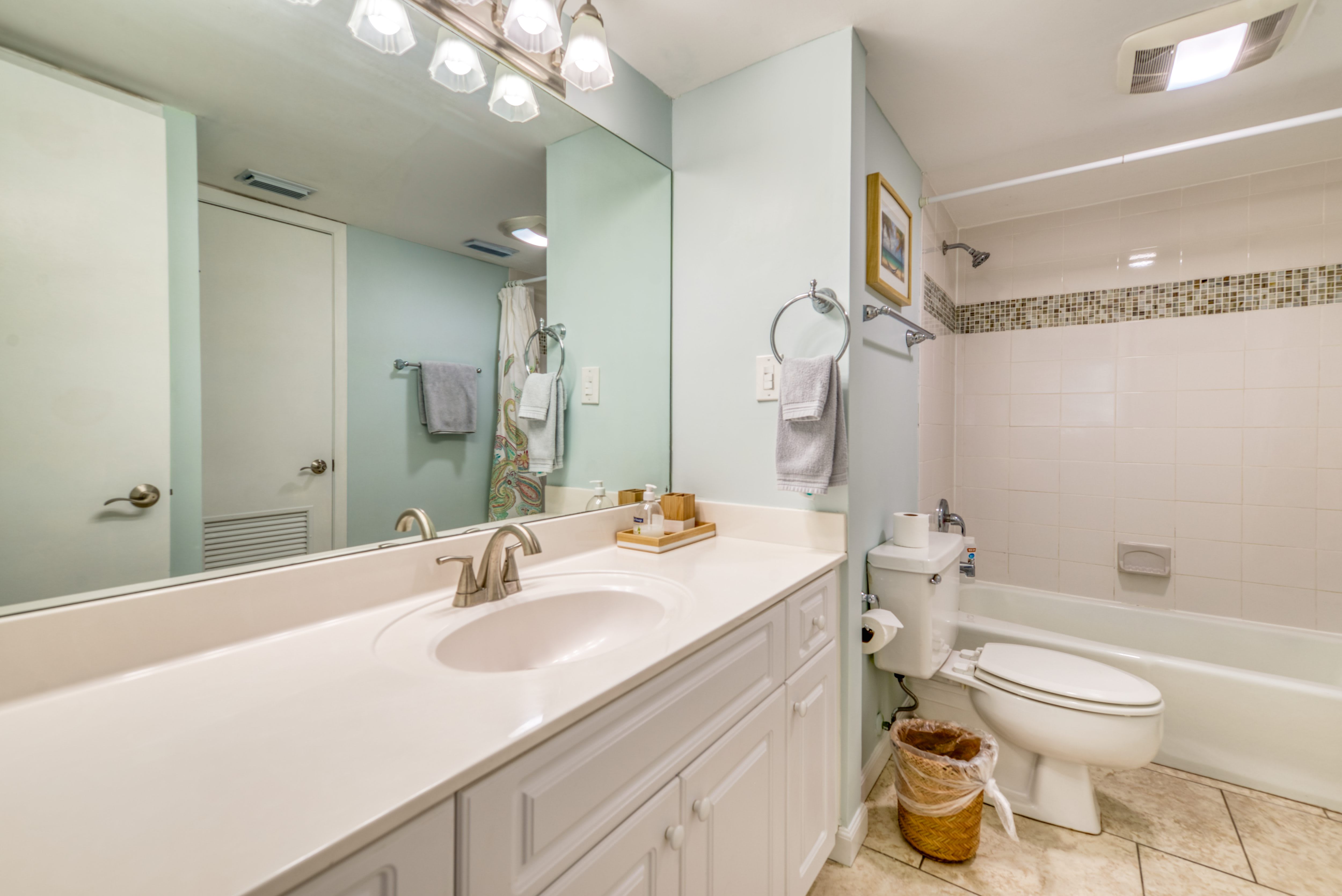 A clean and spacious bathroom with plenty of counter space.