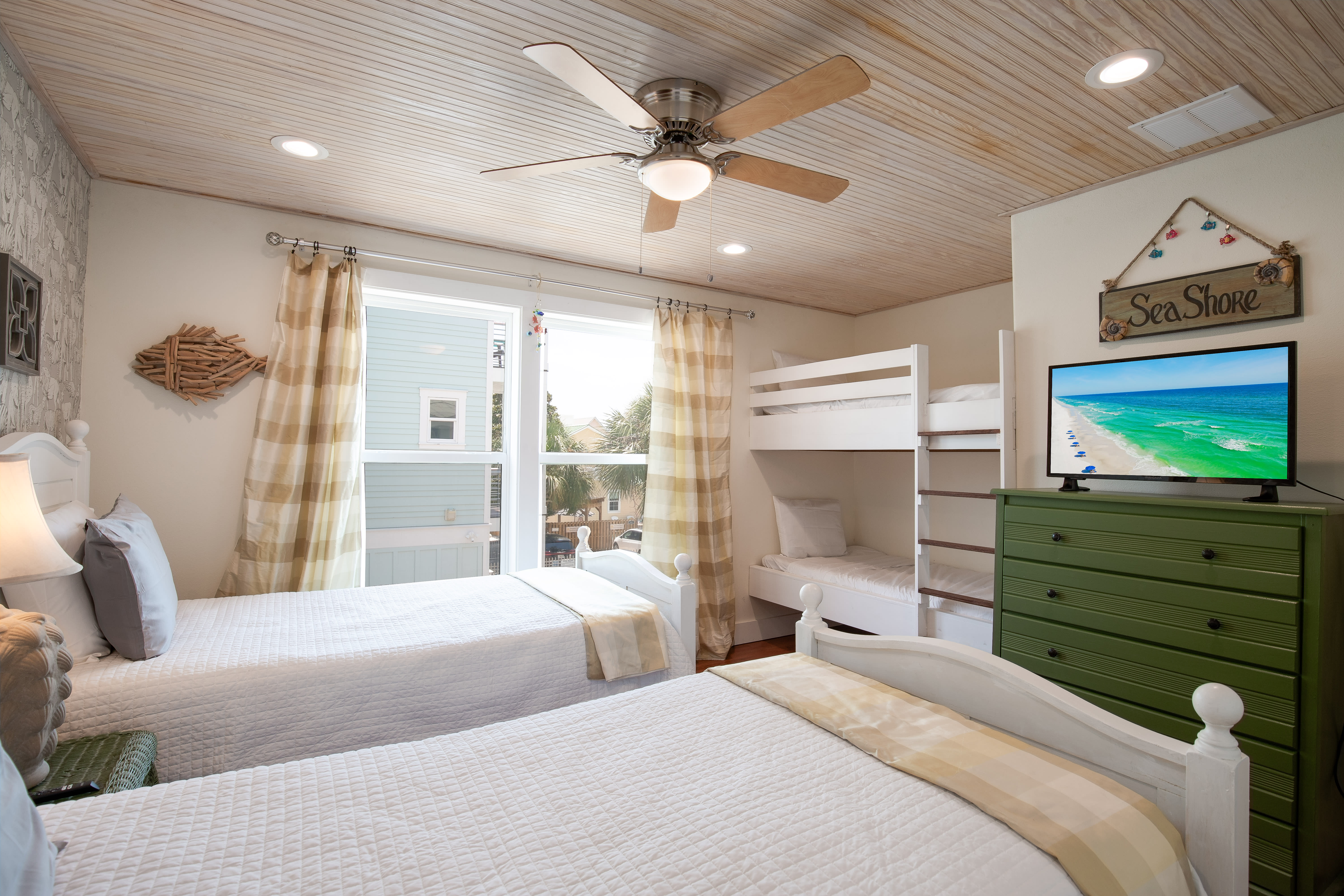 Upstairs BR with two twin beds and two twin bunk beds - room sleeps 4 total.