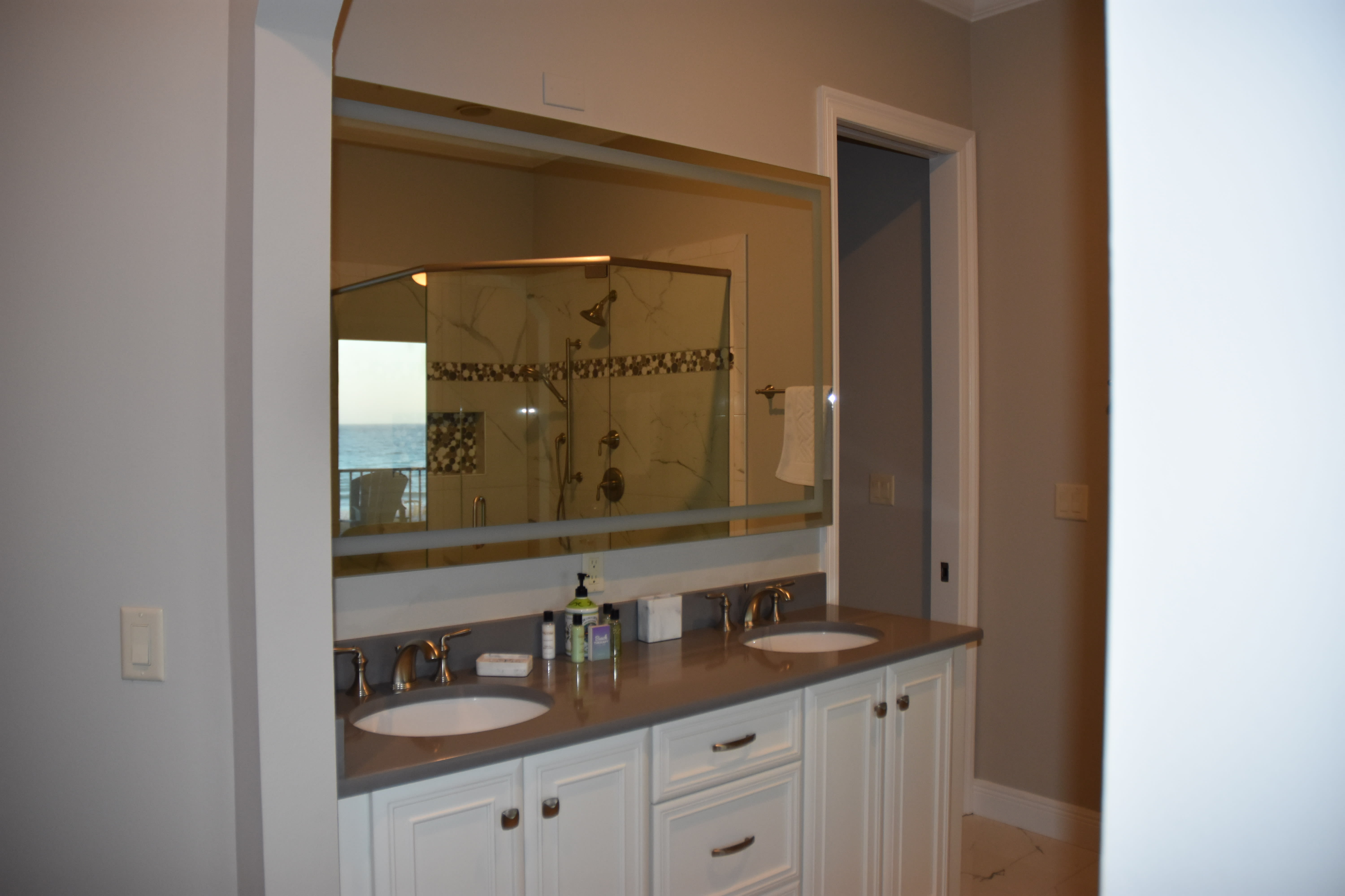 Lighted mirror and two sinks in the master bath with a view - redone in 2022