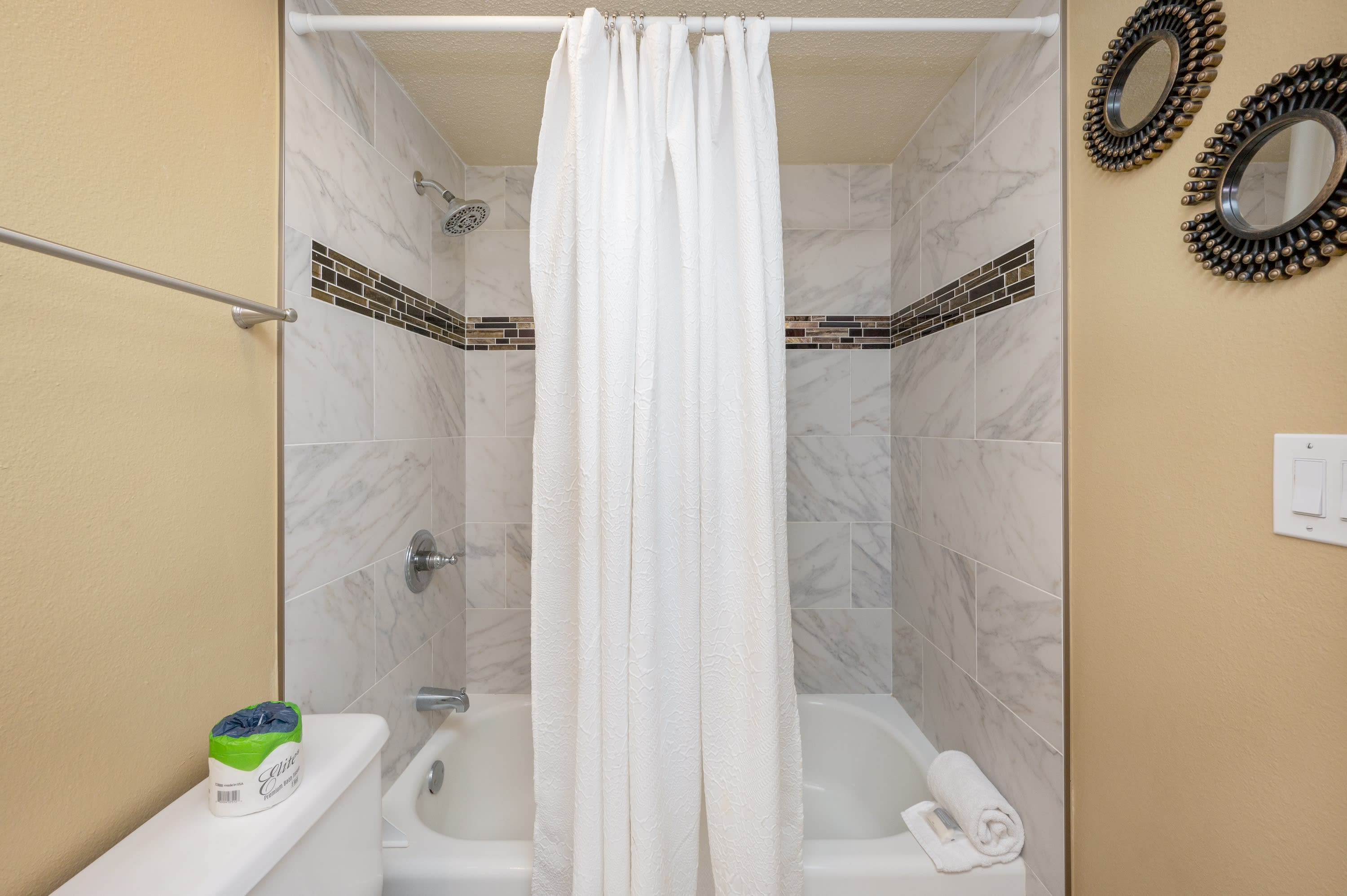 The third bathroom also has a new beautiful marble-look tile 