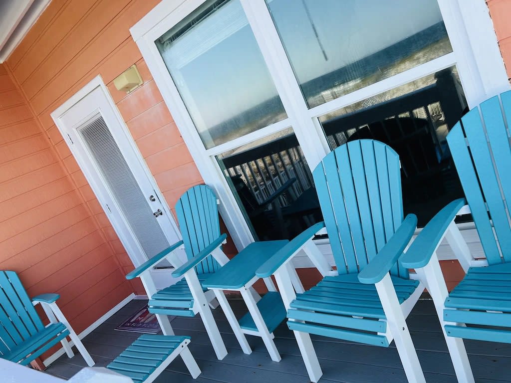 Balcony on main level by living room that goes to pool