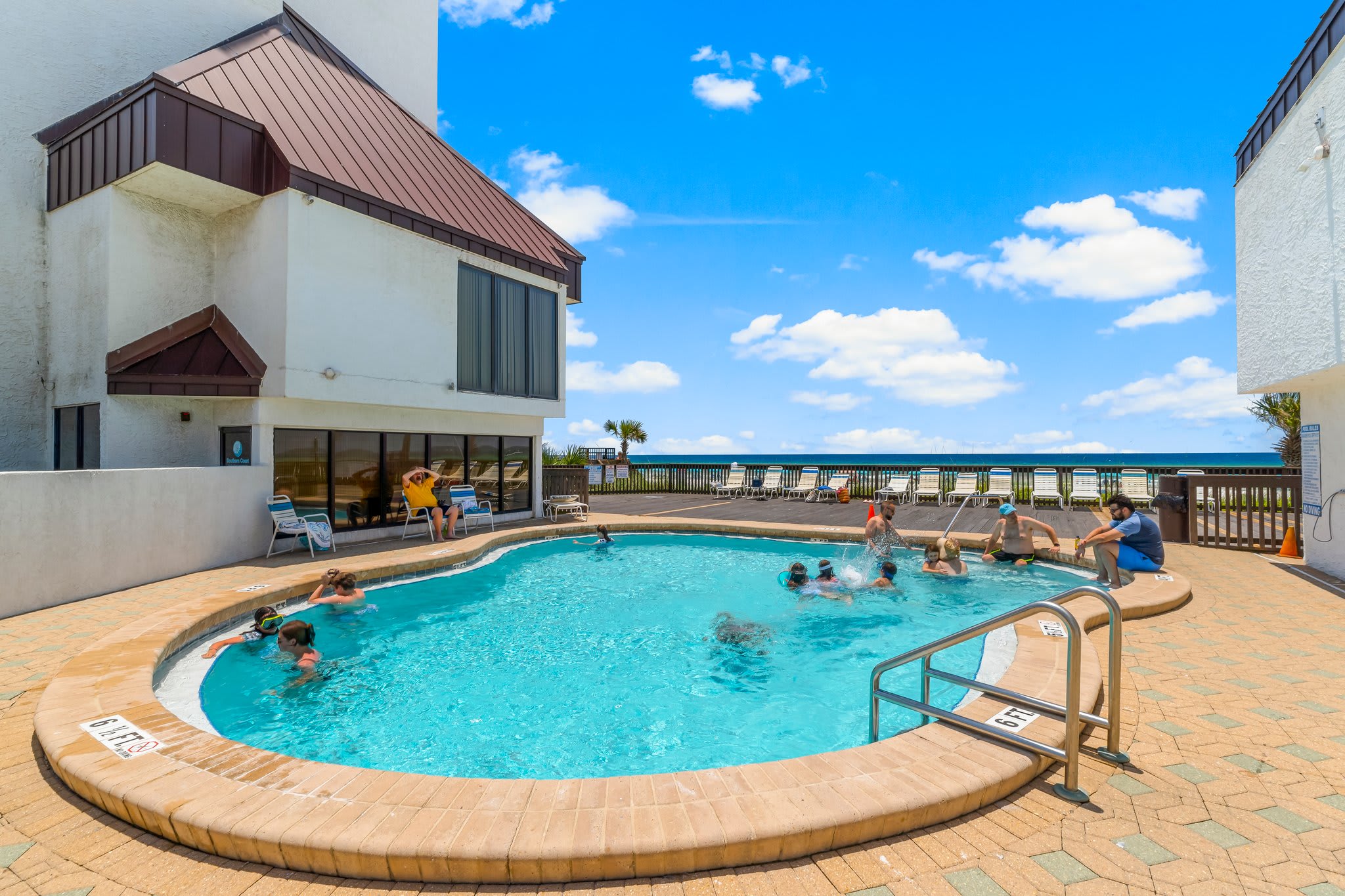 Newly resurfaced pool and lots of lounges and seating