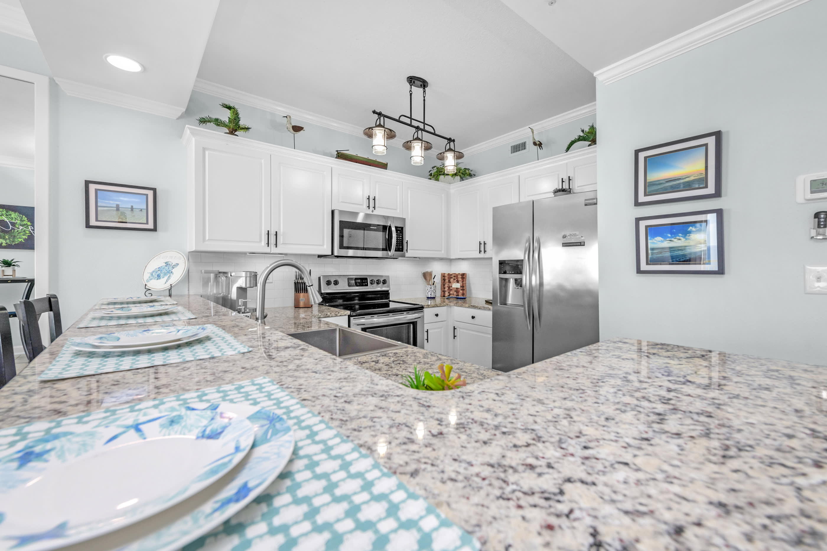 Fully stocked kitchen with large bar for relaxed counter top dining
