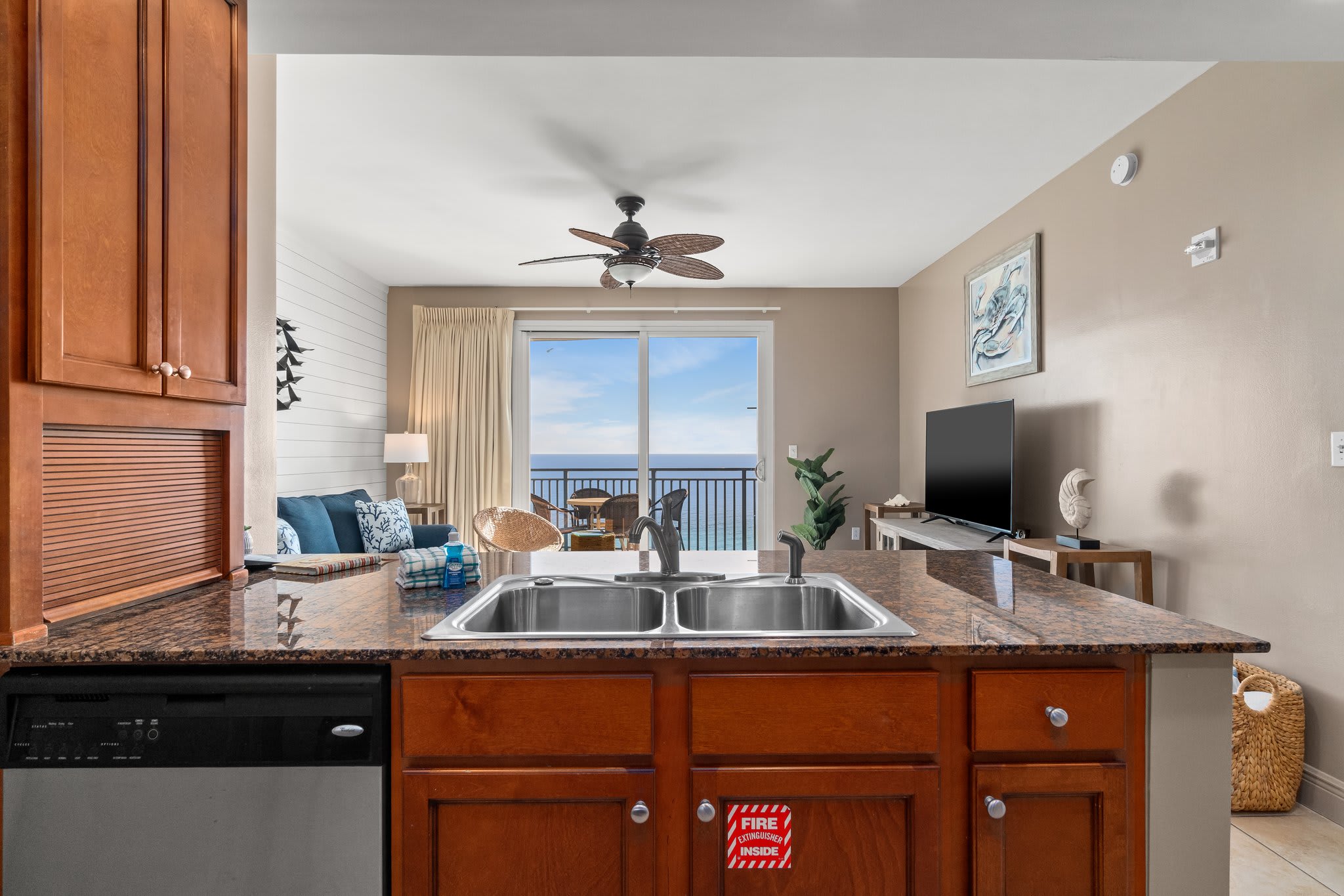 Kitchen showing the living room and balcony