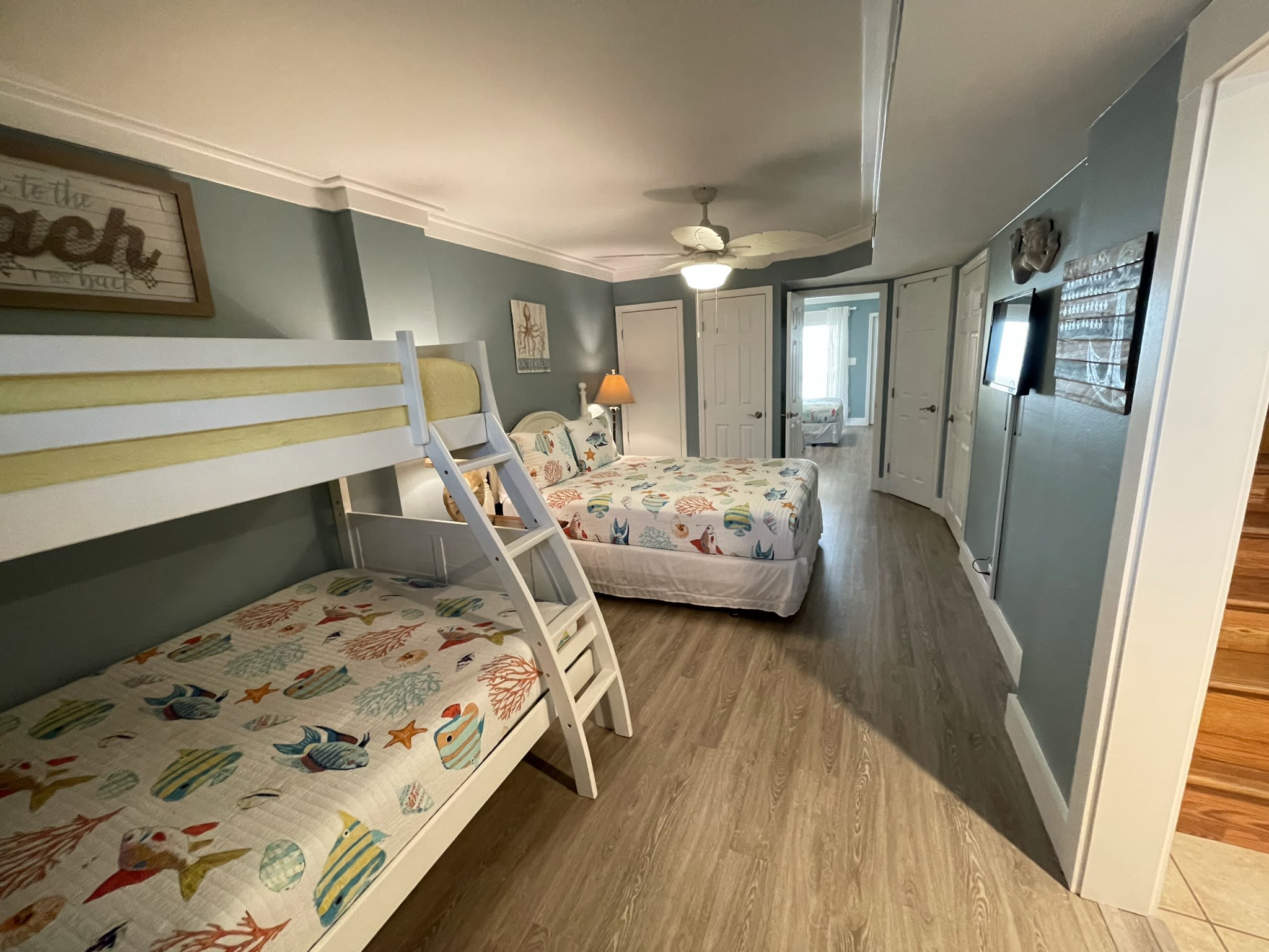 Family lower level front bedroom: queen bed,new twin over full bunk. Entryway on right