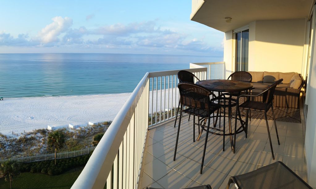 Endless water views! large outdoor sectional, two chaise lounges, and dining set.